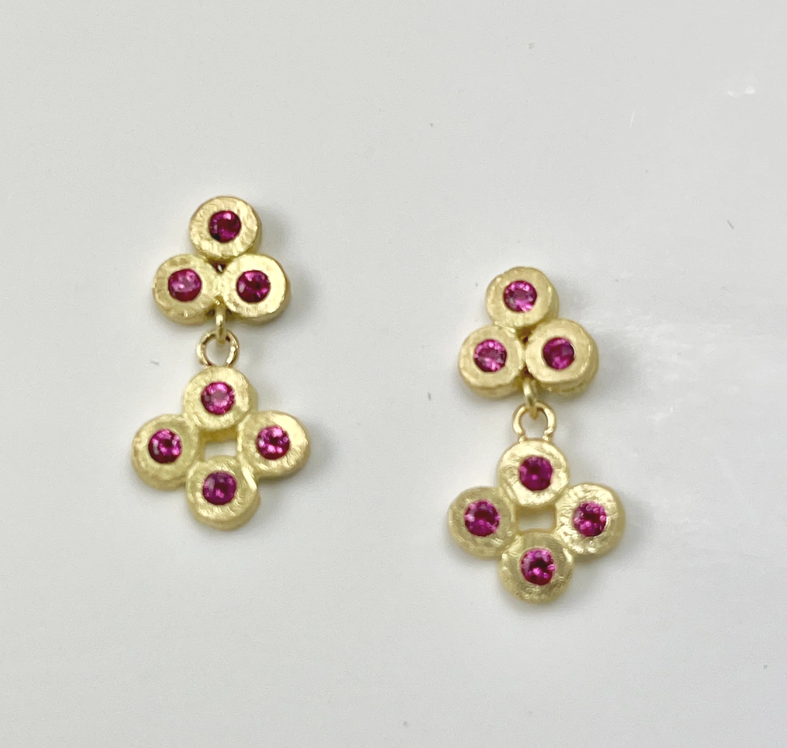 Festive: Siena earrings in 18K set with 0.39ct deep pink sapphires.