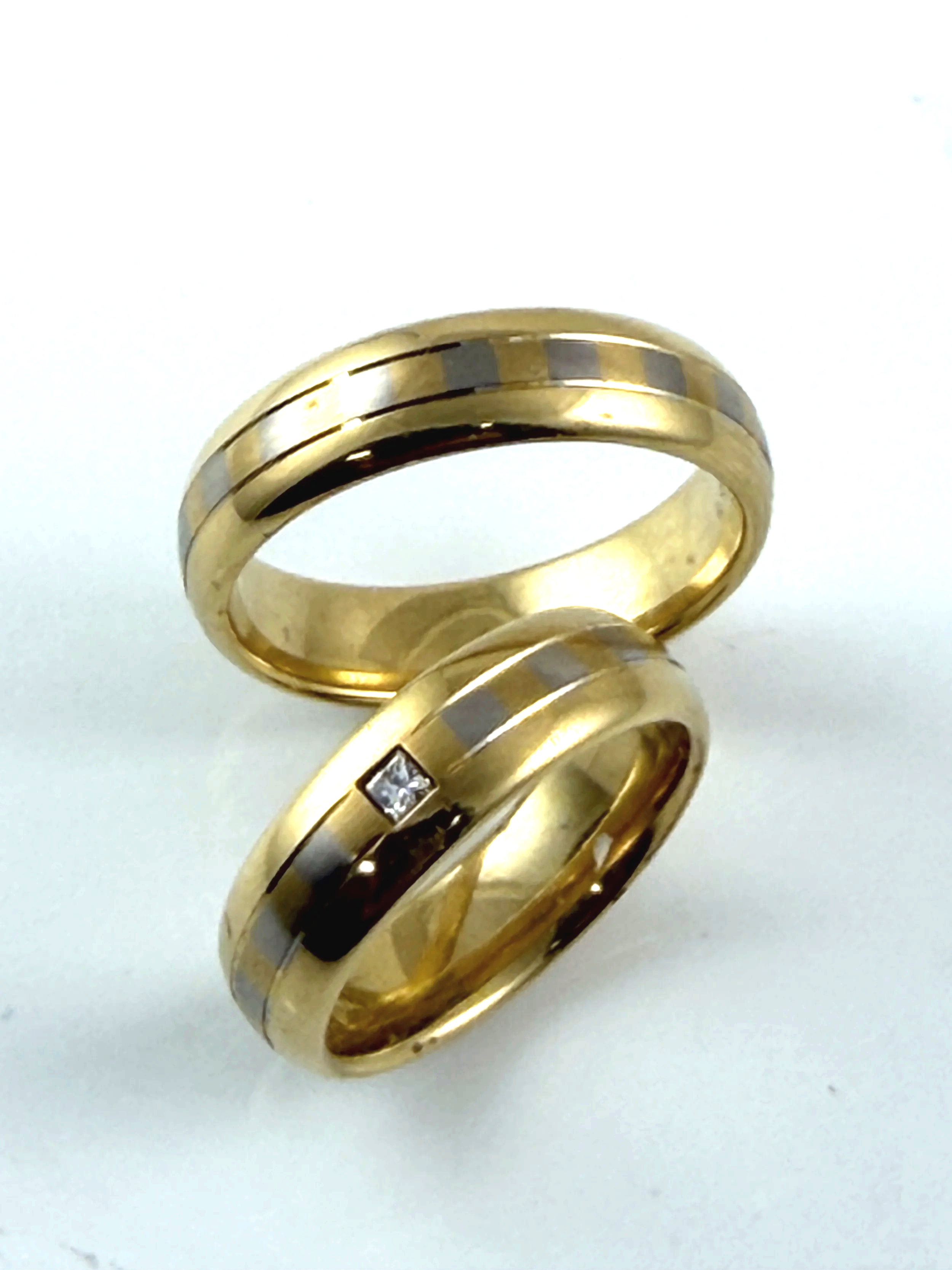 Bands by Peter Heim:  18K checkerboard design, Size 7 set with 0.05ct princess cut diamond, $3455. and the size 10 band, $3500.