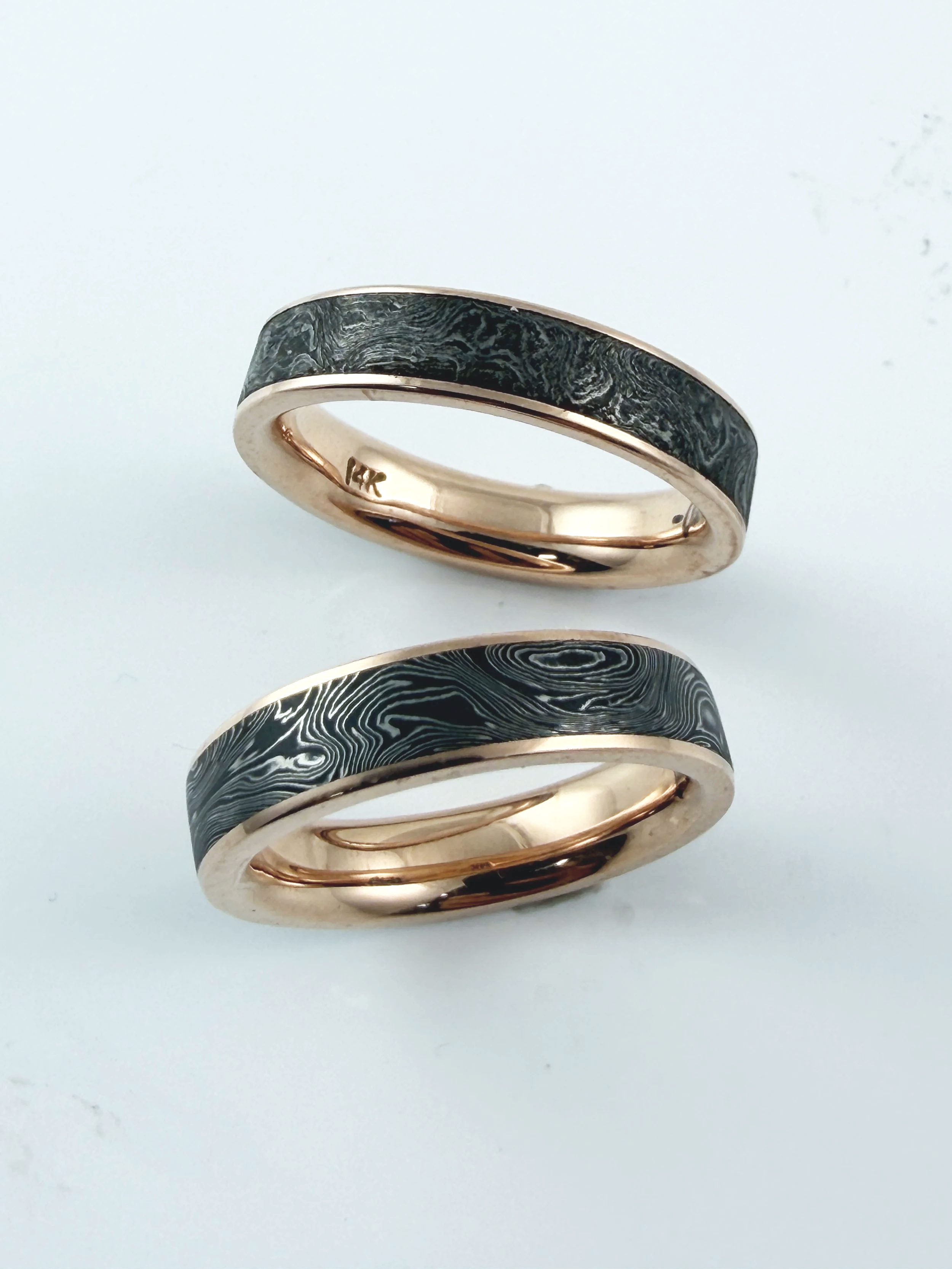 Bands by Drackbar,  14K Rose gold with stainless steel inserts.  Size 9, $3500 and size 10.5 $4000.