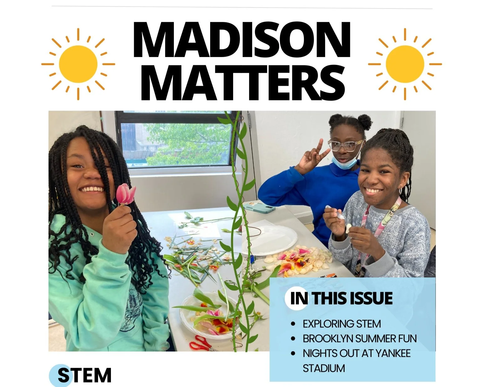 Girls hold flowers while smiling