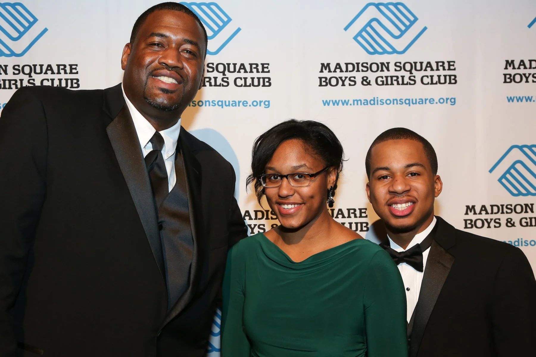 Three Madison Members and Staff Smile for the camera at a Madison event