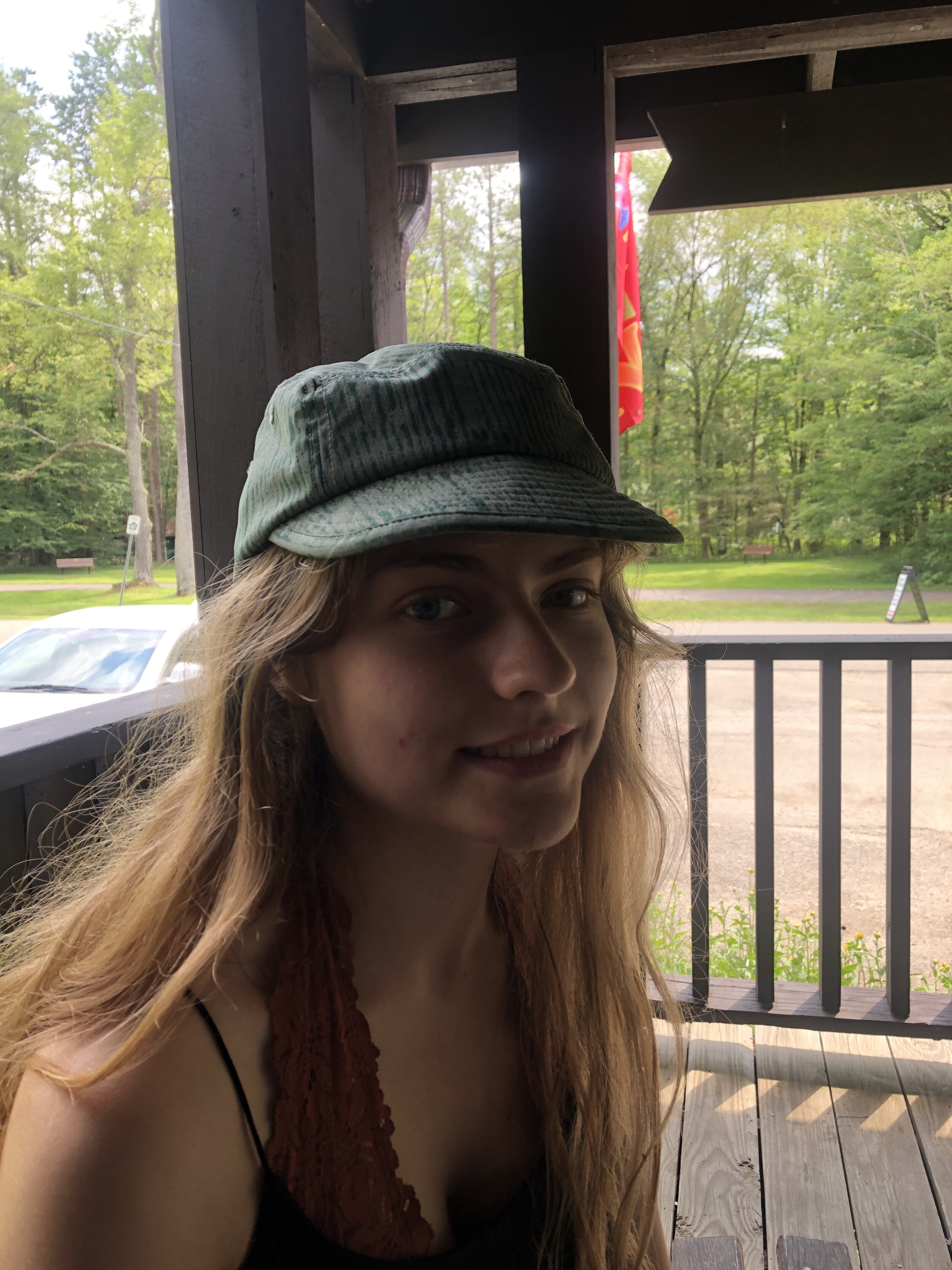 Stephanie Trying on John's Hat