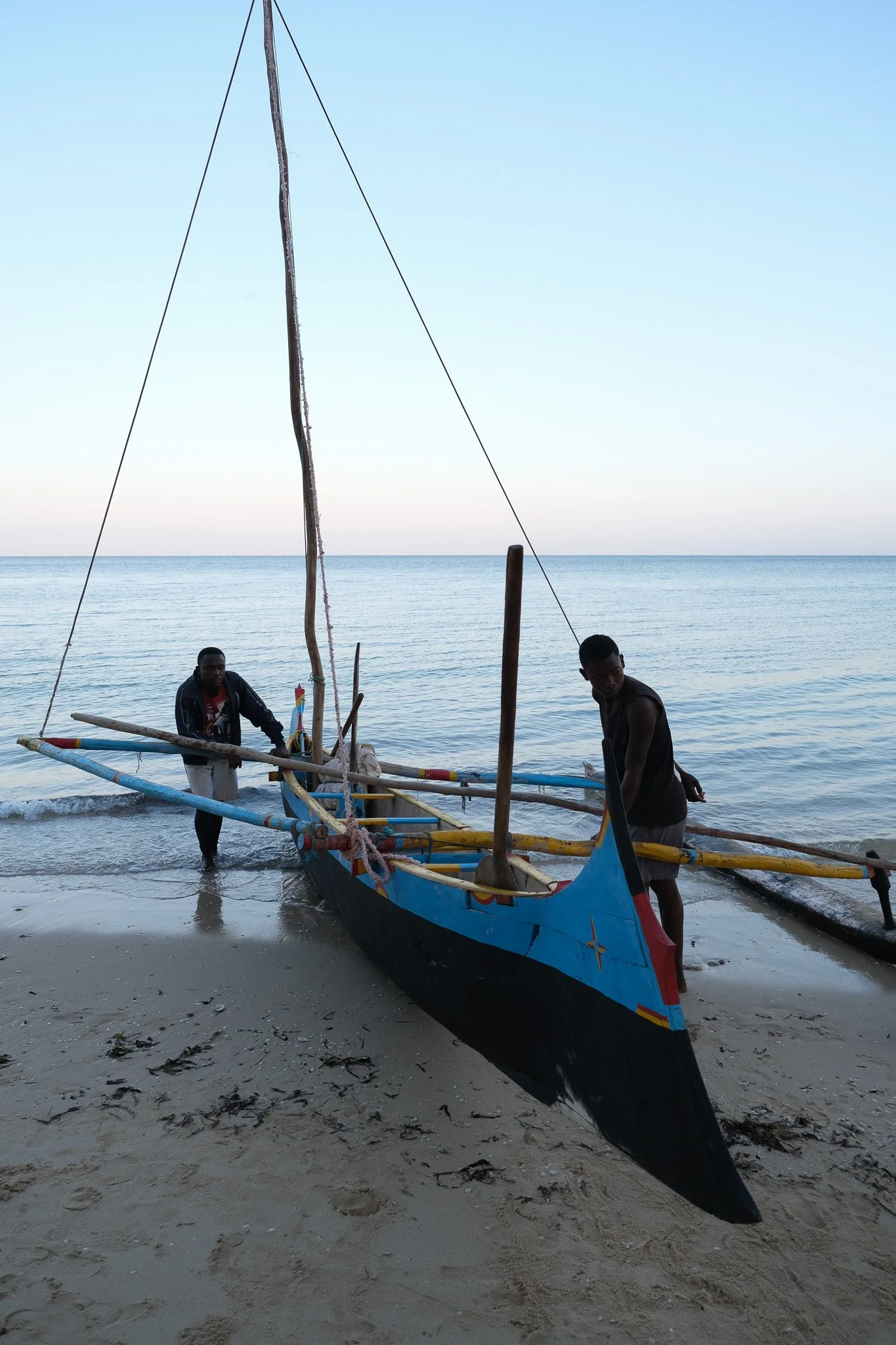 Malagasy fisherman handcraft their boats with whatever materials they can gather. Sometimes this includes the wooden sticks unwinding in the open sea, requiring fishers to jump in and retie the knots.