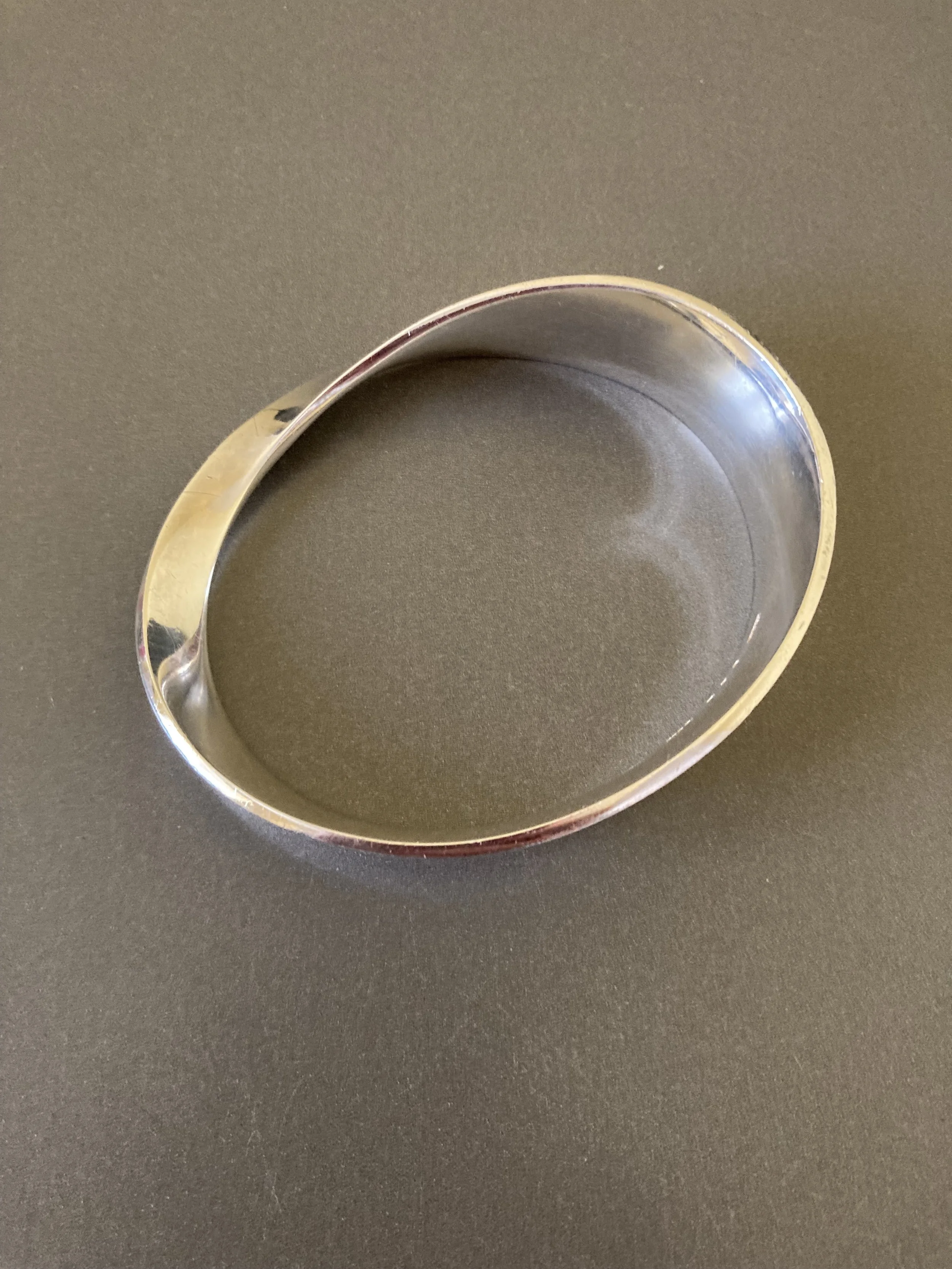 Georg Jensen "Moebius" Silver Bangle. By Vivianna Torun Bulow Hube.