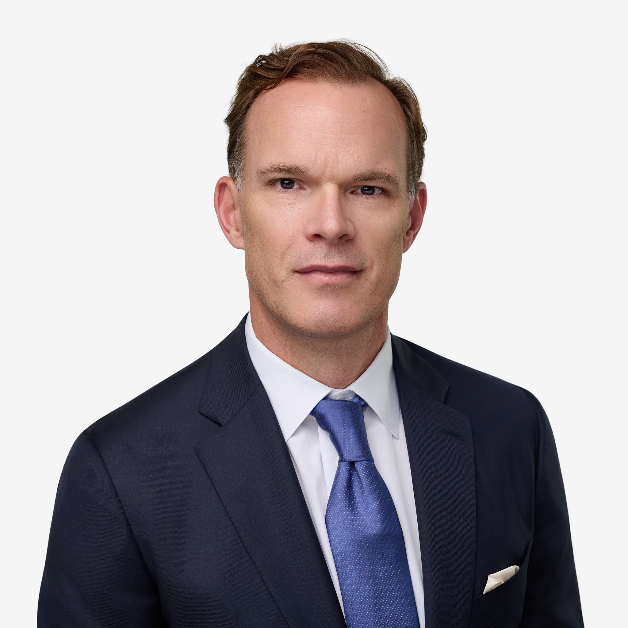 Formal attorney headshot in a dark suit and blue silk tie, professional legal portraiture in Westport, CT by N. Lalor Photography.