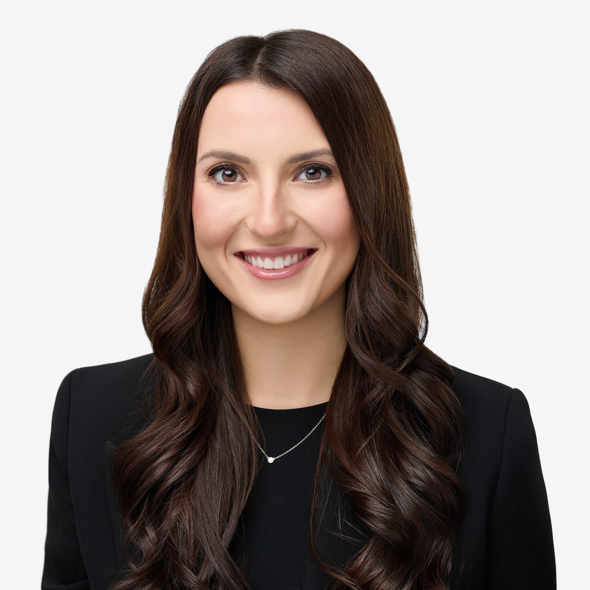 High-end corporate headshot of a smiling female professional, clean white background, commercial photography by N. Lalor Photography.