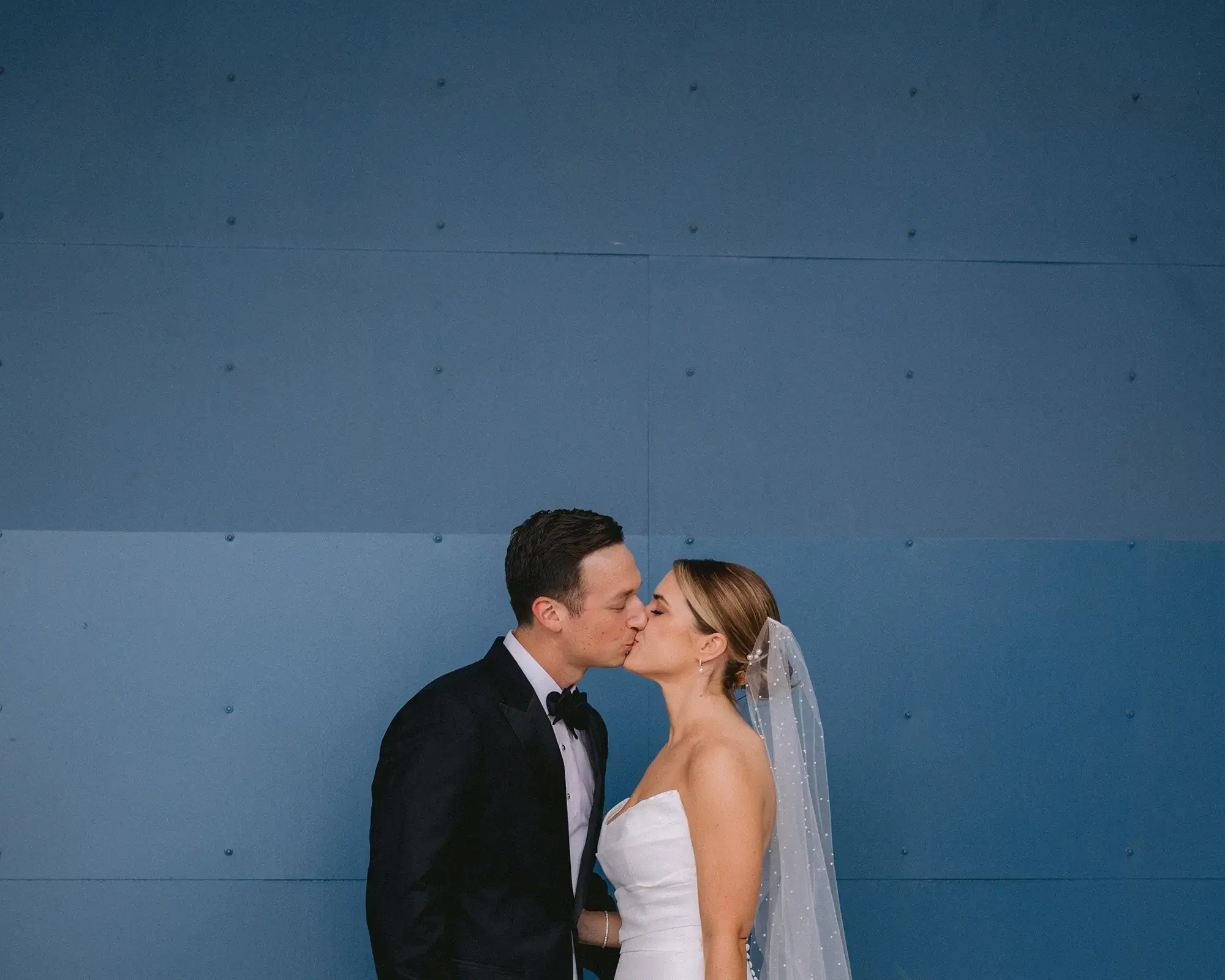 Bride-Groom-Kiss-Wedding-Portrait-Los-Angeles.webp