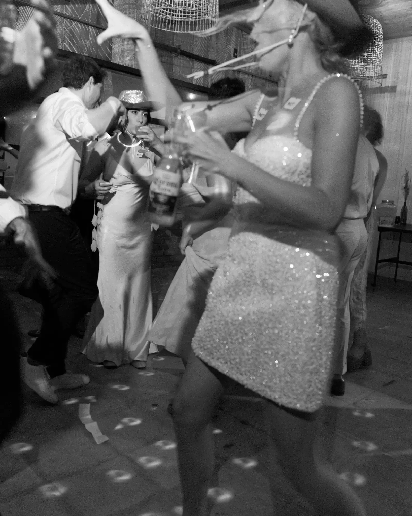 The bride and her wedding guests dancing and socializing at a wedding after party