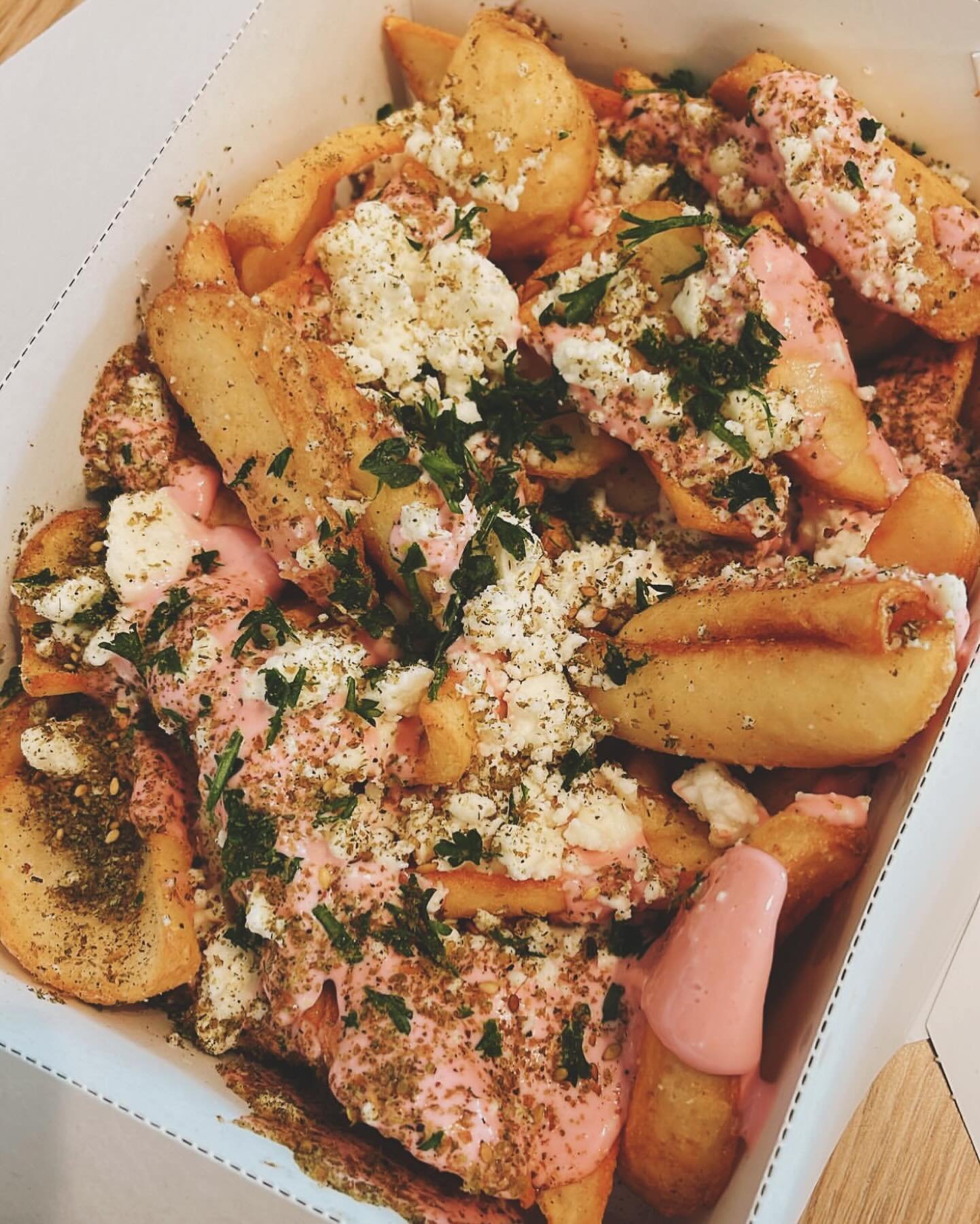 Garlic feta fries with our famous pink mayo. #chicagorestaurants #chicagolebanesefood #chicagofries #chicagolunch