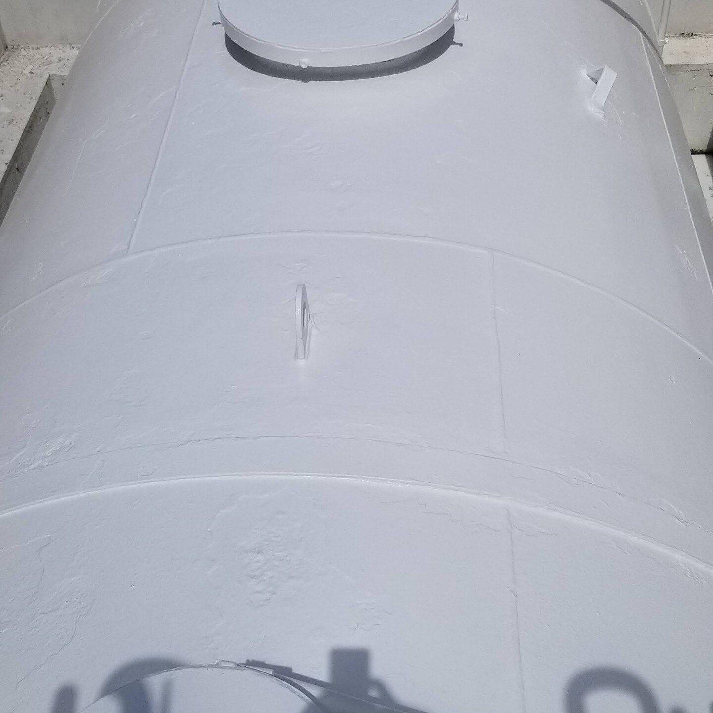 After grinding, putting rust converter and applying epoxy and primer, we finished up with industrial DMT topcoat.