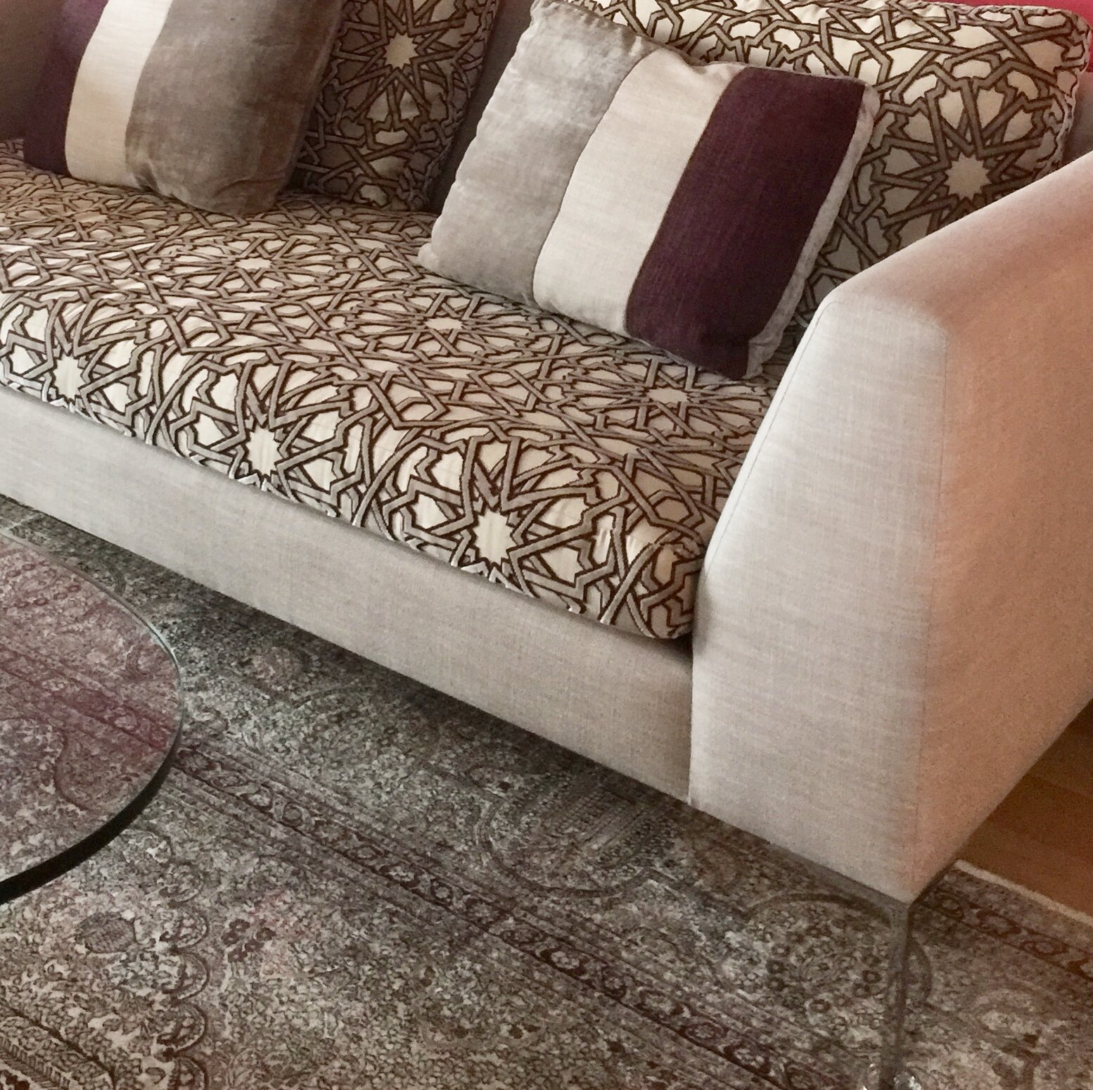  Custom sofa with fabrics that tie in existing pieces. 