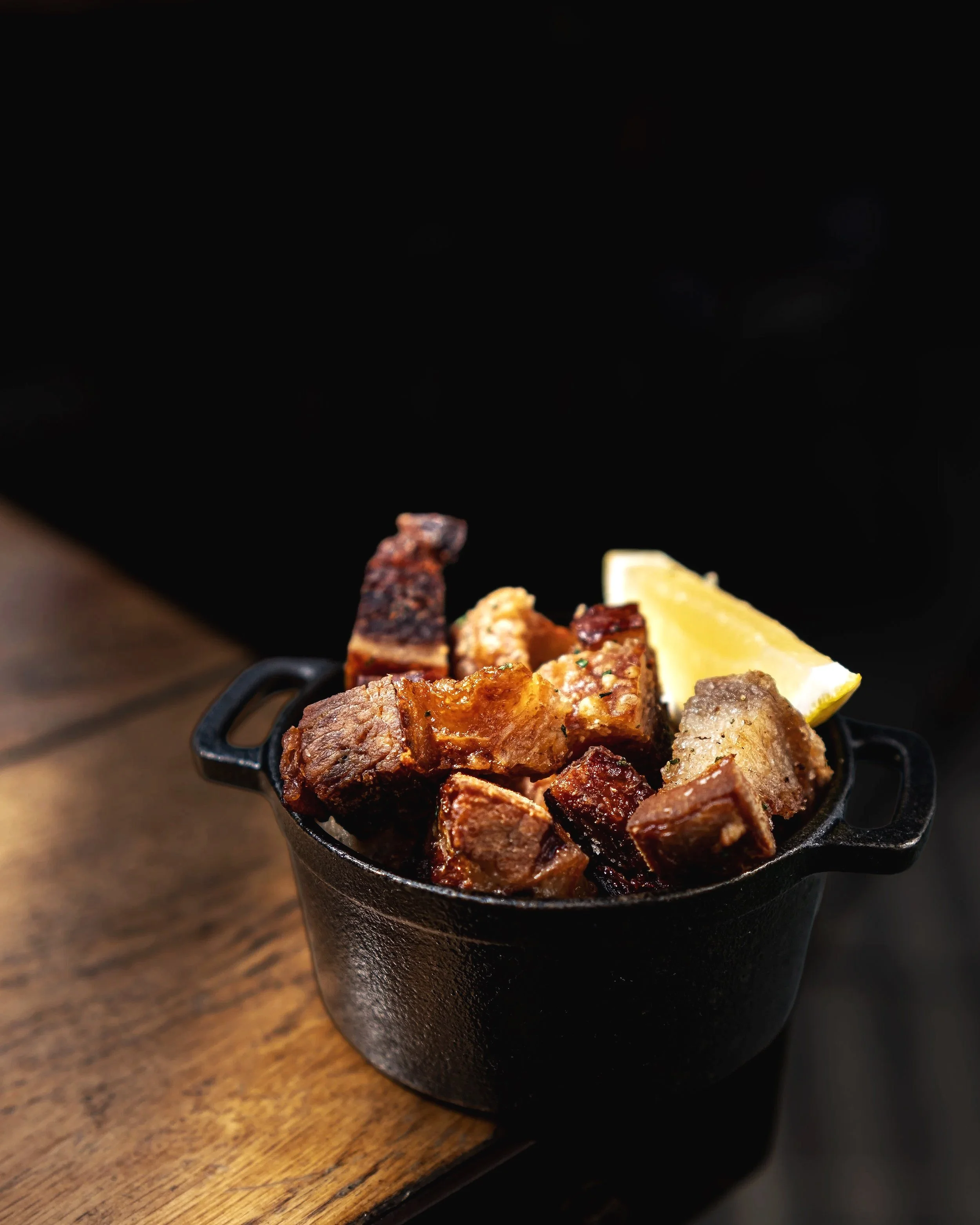 Chicharrónes - pork rinds or pork cracklings in English. The translation refers to crispy, fried pork skin. 