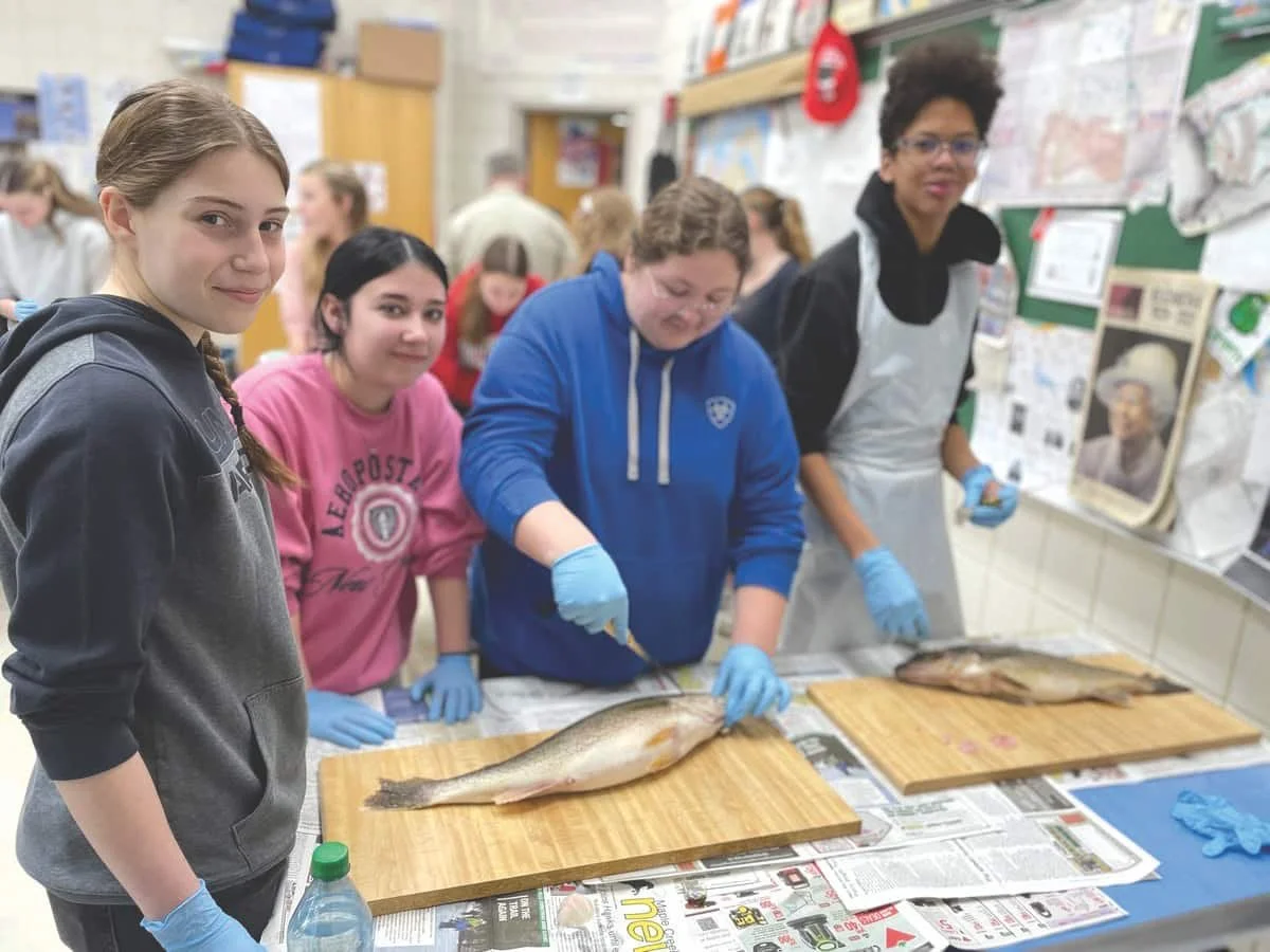 Conservation officers teach Leader students about fish ecology, filleting
