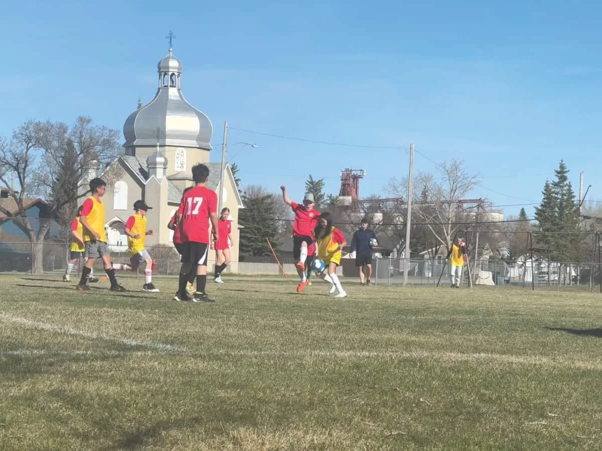 Boots, ball, blue sky