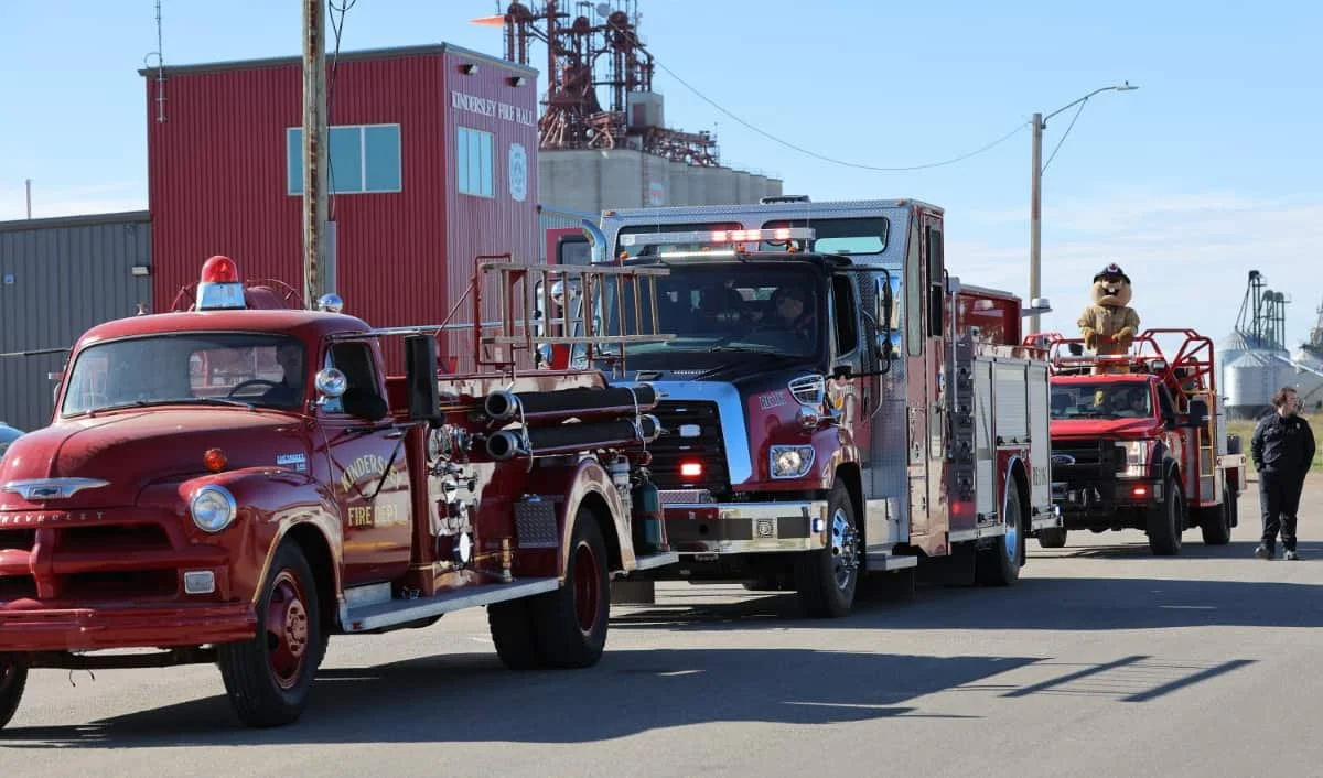 Three generations of Fire Department Trucks