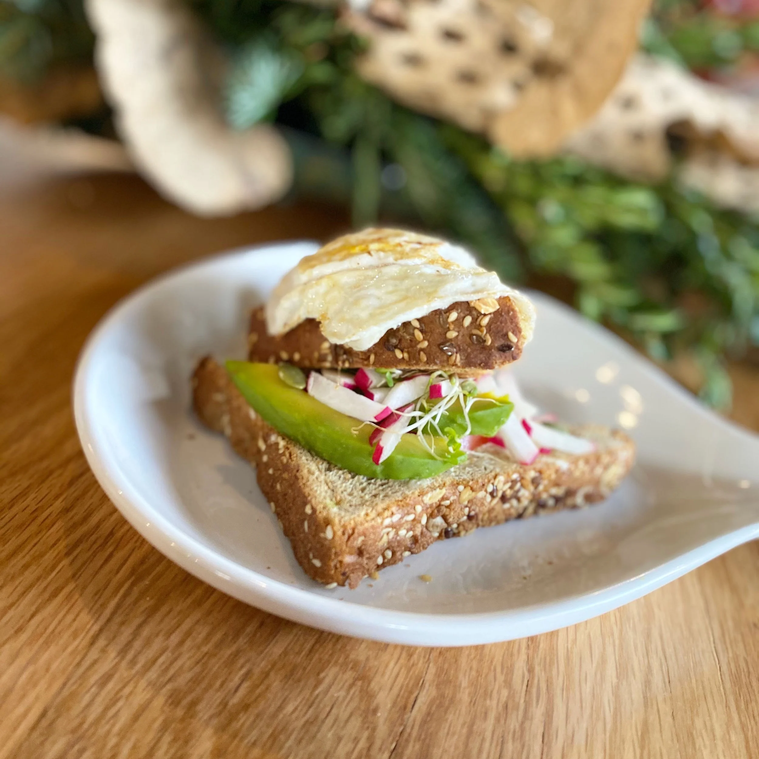 sandwich with avocado, egg, and radish