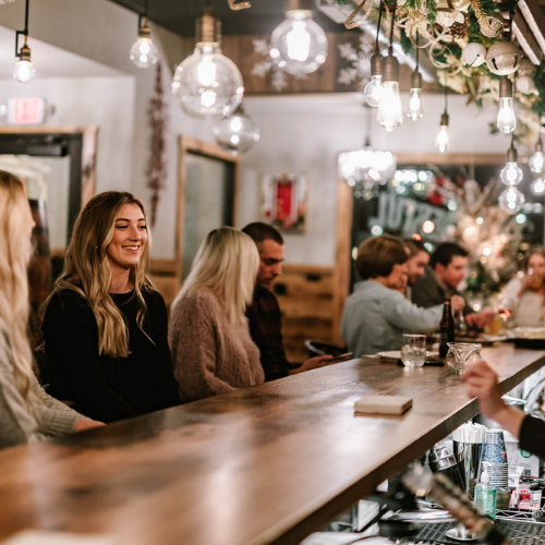 People sitting at the bar at The Leaf