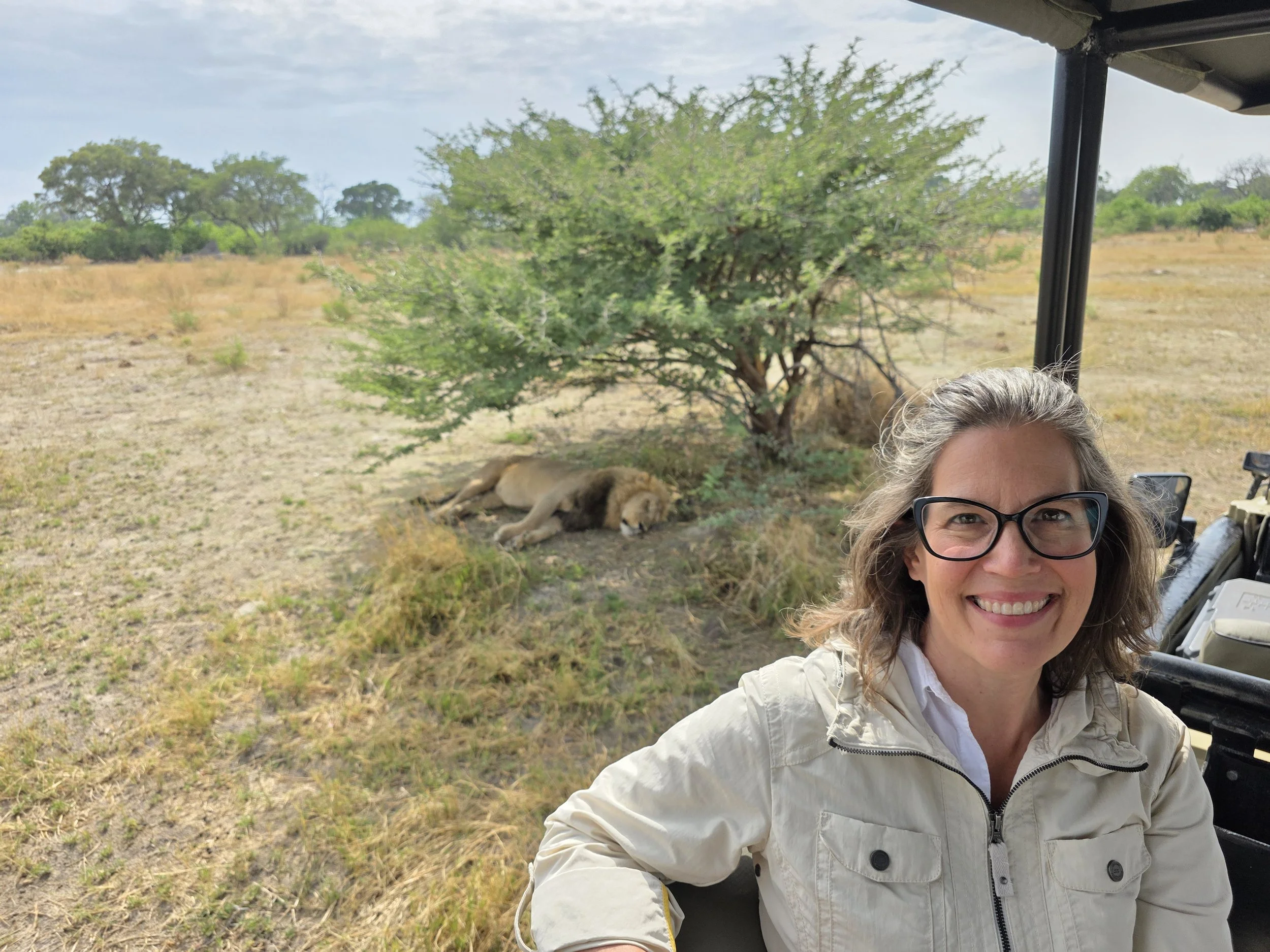 Heather with lions on safari.jpg