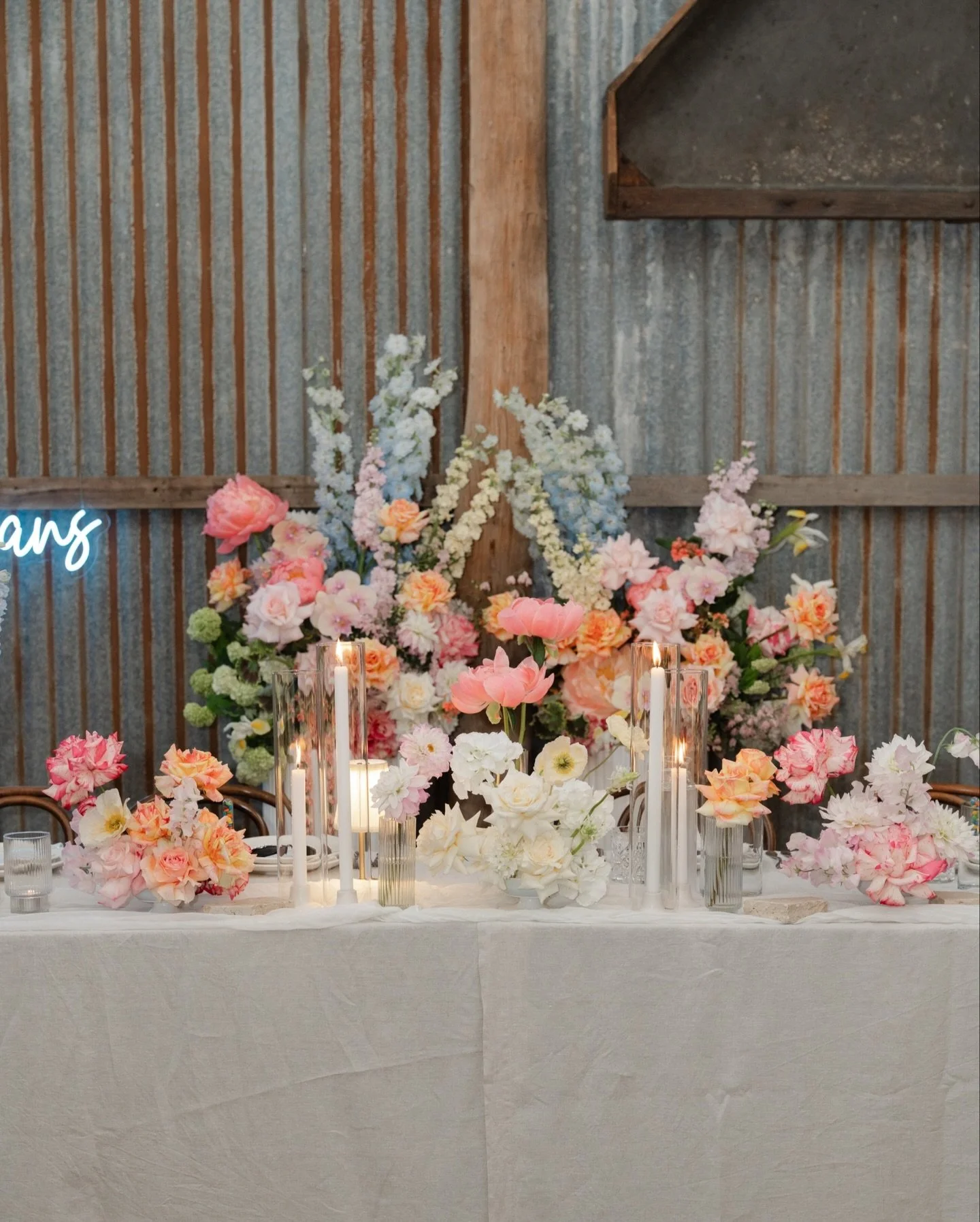 Selina &amp; Scott went with one of our favs for their florals. Sarah from @theflowerpursuit delivered a beautiful explosion of bright flowers for the wedding reception. There&rsquo;s always that &ldquo;WOW&rdquo; moment when you walk into The Packin