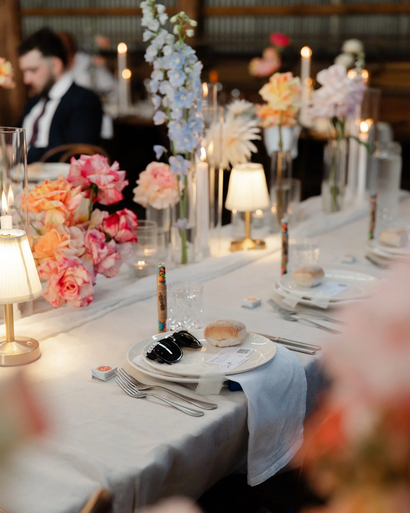 Flowers and lighting can change everything. It is the major component for truly elevating your wedding reception. If your budget allows for a venue filled with florals. Amazing! If not the way you style the tables with runners, tablecloths, candles o