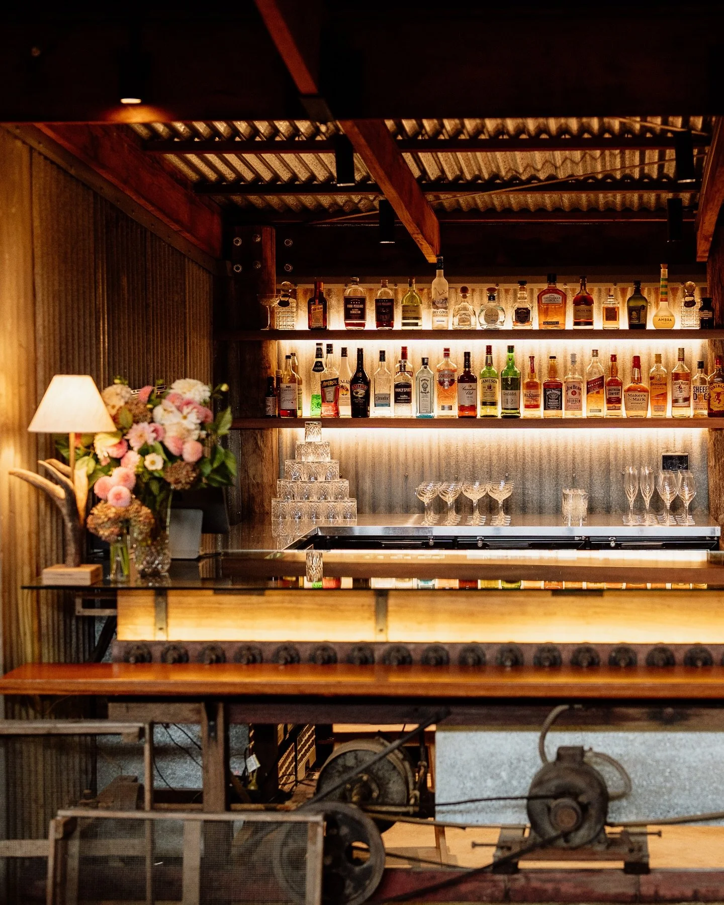 The Packing Shed bar. Paying homage to the history of the property, by repurposing the original conveyor belt used to take the oranges to the grader in The Packing Shed. Unique pieces like this make Lilburndale a one-of-a kind wedding venue.