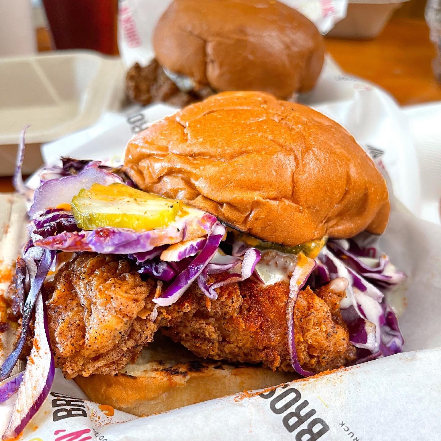 📍San Jose, CA @chicknbros.sj 
Say hello to this Nashville Fire - beer battered fried chicken with an orange spicy adobo aioli sauce, white tangy sauce, onions, pickles, purple cabbage, paprika, chili oil, and honey all on a brioche bun. 

I&rsquo;m 