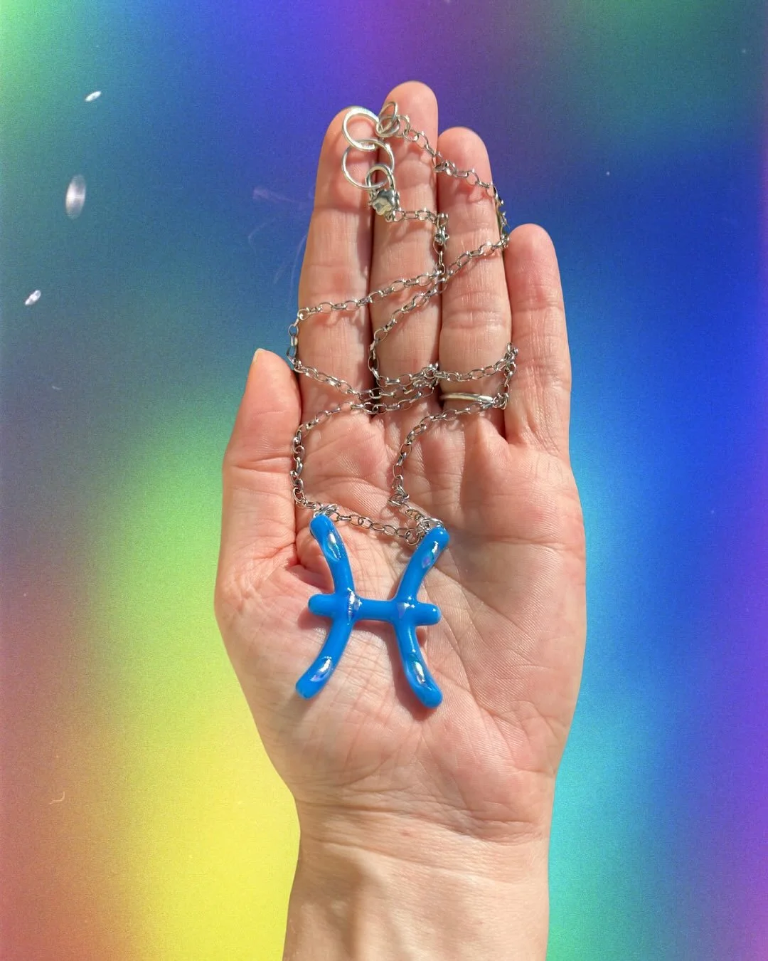 recently made this custom pisces necklace and i love it so much 🩵 this is your reminder that custom zodiac necklaces are available on our site 🌐 choose your color!! pick the findings! represent your sign proudly with your very own fused glass piece