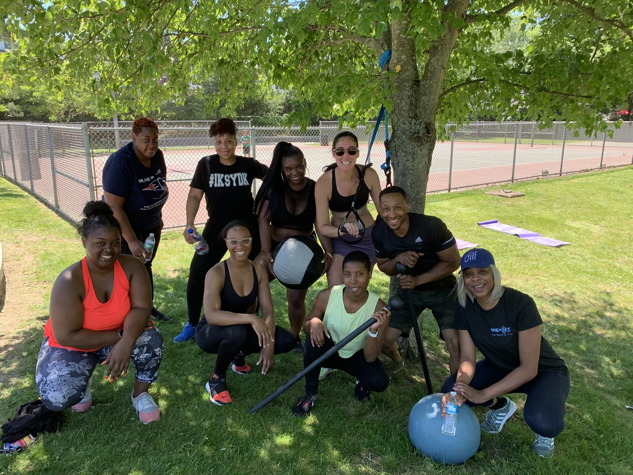 Rooted Fitness Collective clients and coaches after an outdoor group training session