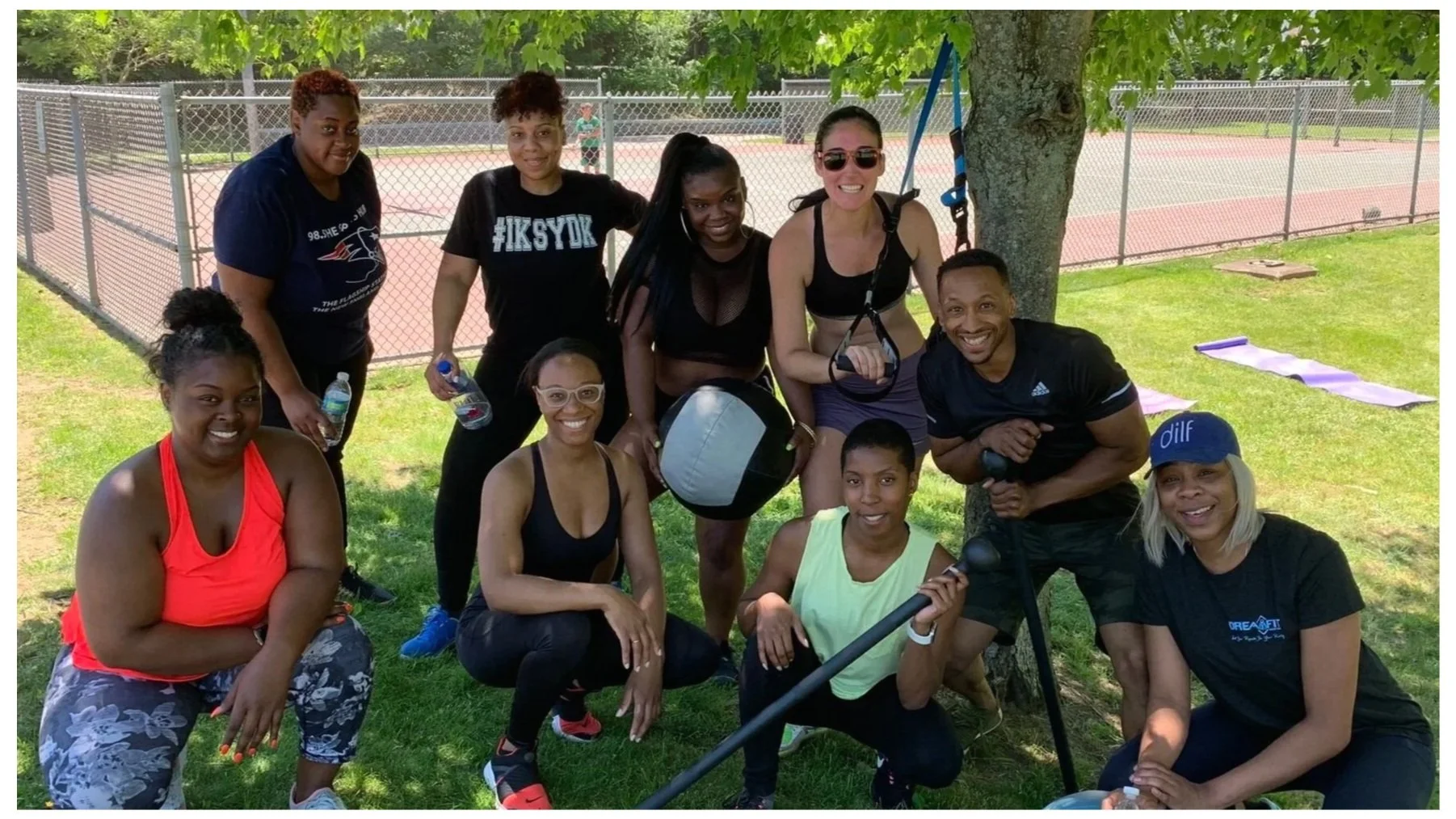 Rooted Fitness Collective coach guiding a client through outdoor training