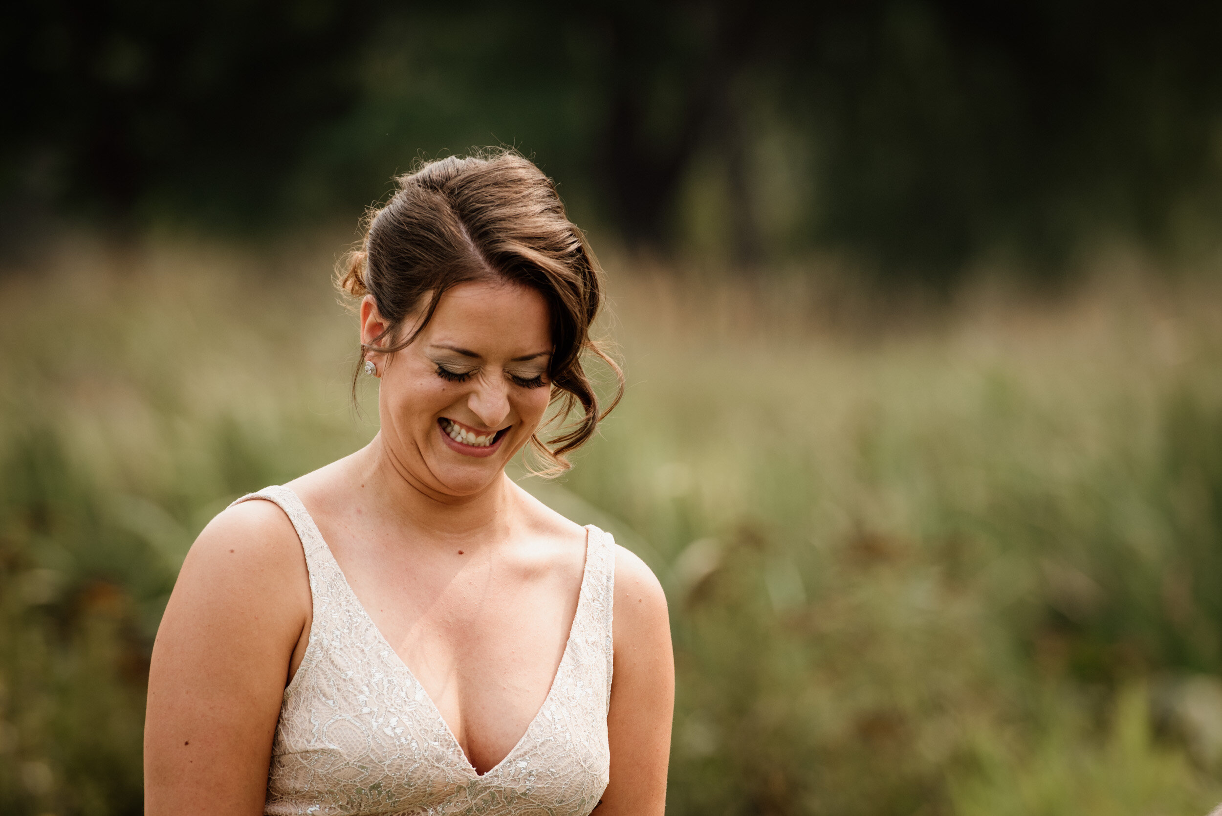 Portrait of bride smiling at wedding ceremony at big sky golf course in Pemberton
