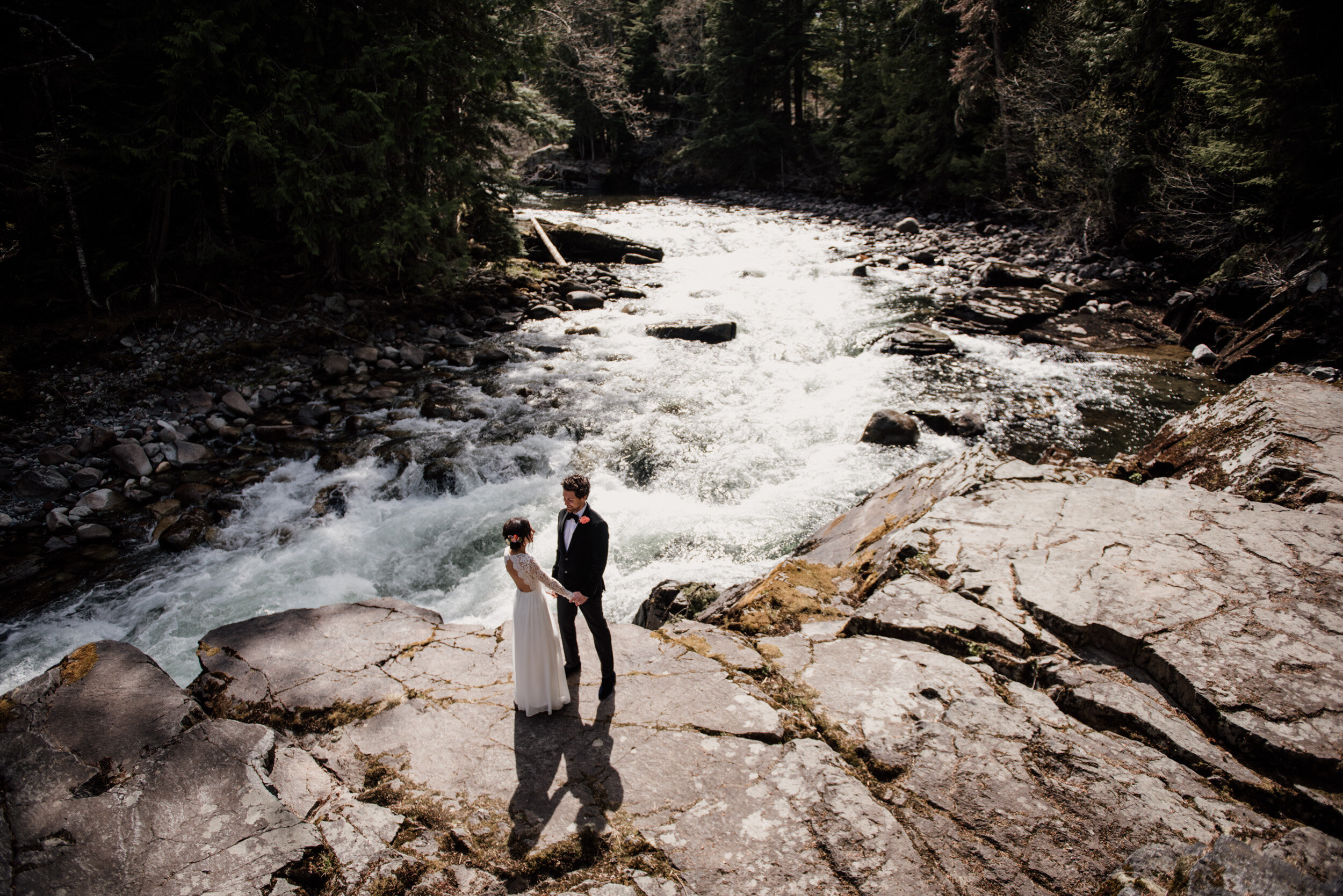 Bride and groom portrait down by the Cheakamus River in Whistler