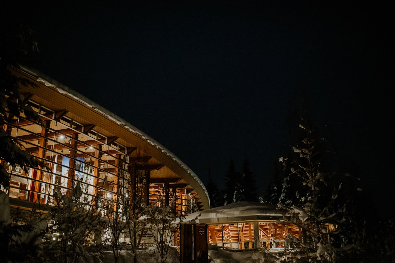 Squamish Lil’wat Cultural Centre at night in the snow