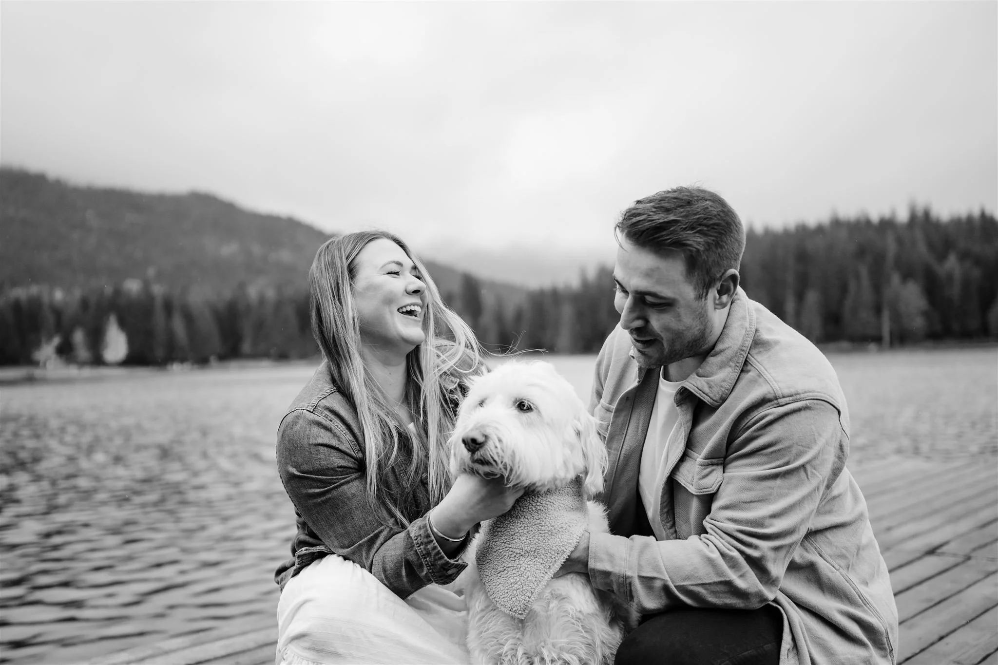 Dog getting pet during engagement session in Whistler