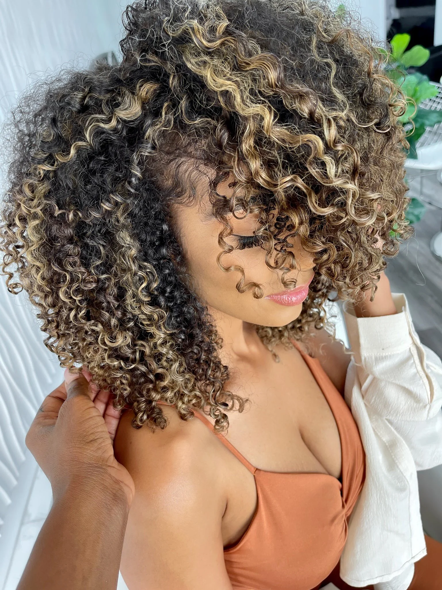 Cover image for 'Embracing Your Curls: The Ultimate Guide to Natural Hair Care' by Salon PK, showcasing natural curls and expert hair care tips. Jacksonville Florida Hair Salon