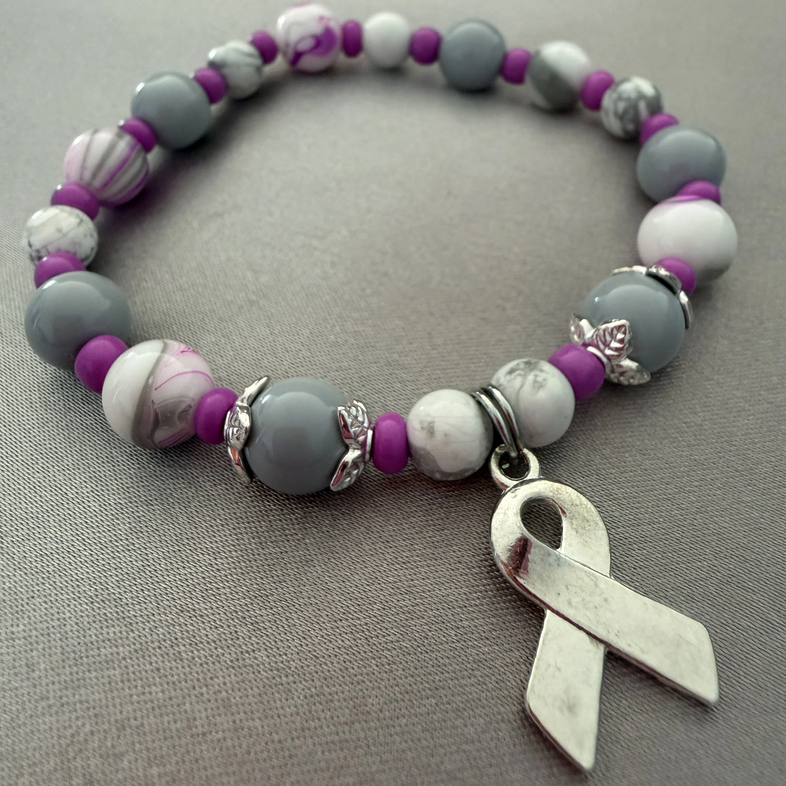 Pink, White and Gray Beaded Bracelet W/Silver Ribbon Charm