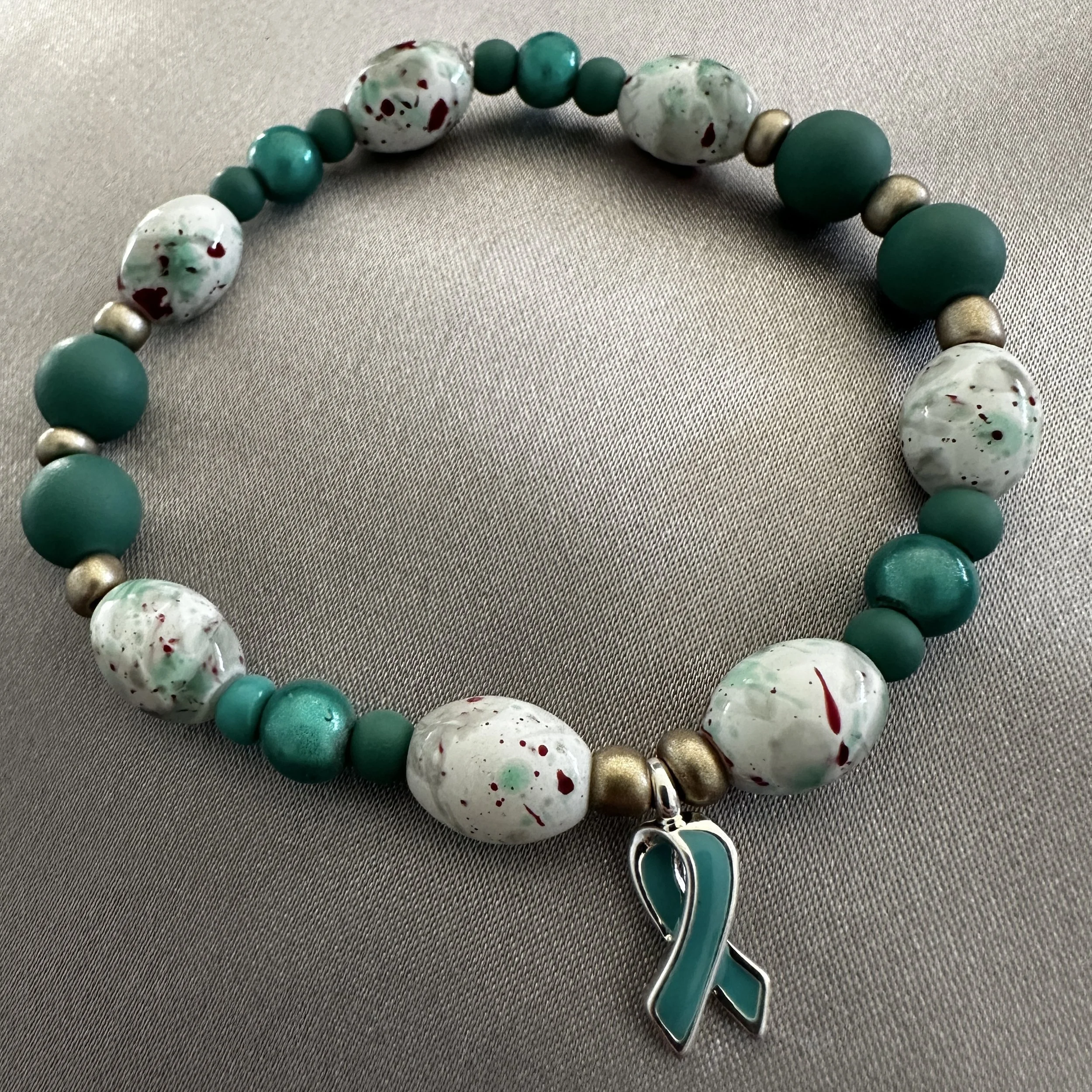 Teal and White Beaded Bracelet W/Teal Ribbon Charm