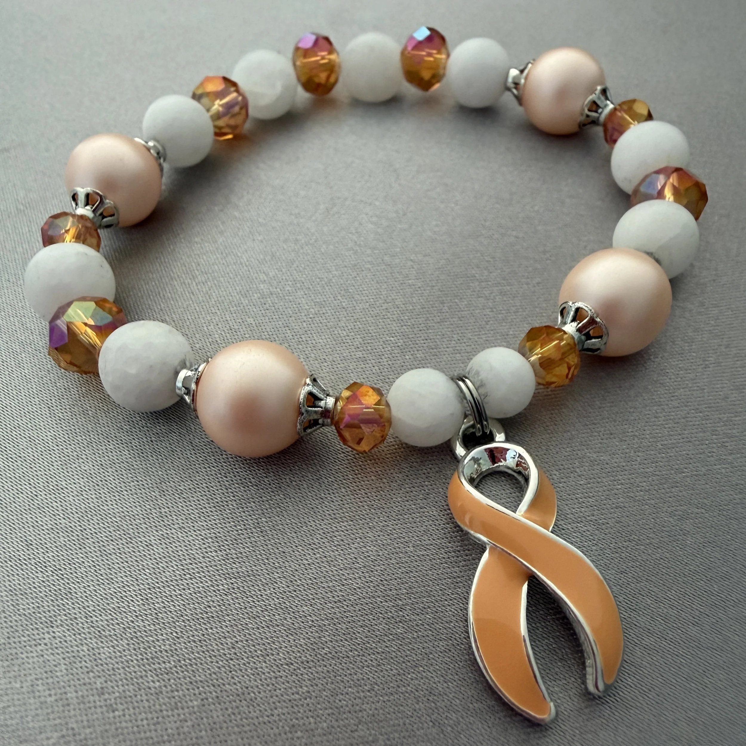 Peach and White Beaded Bracelet W/Peach Ribbon Charm