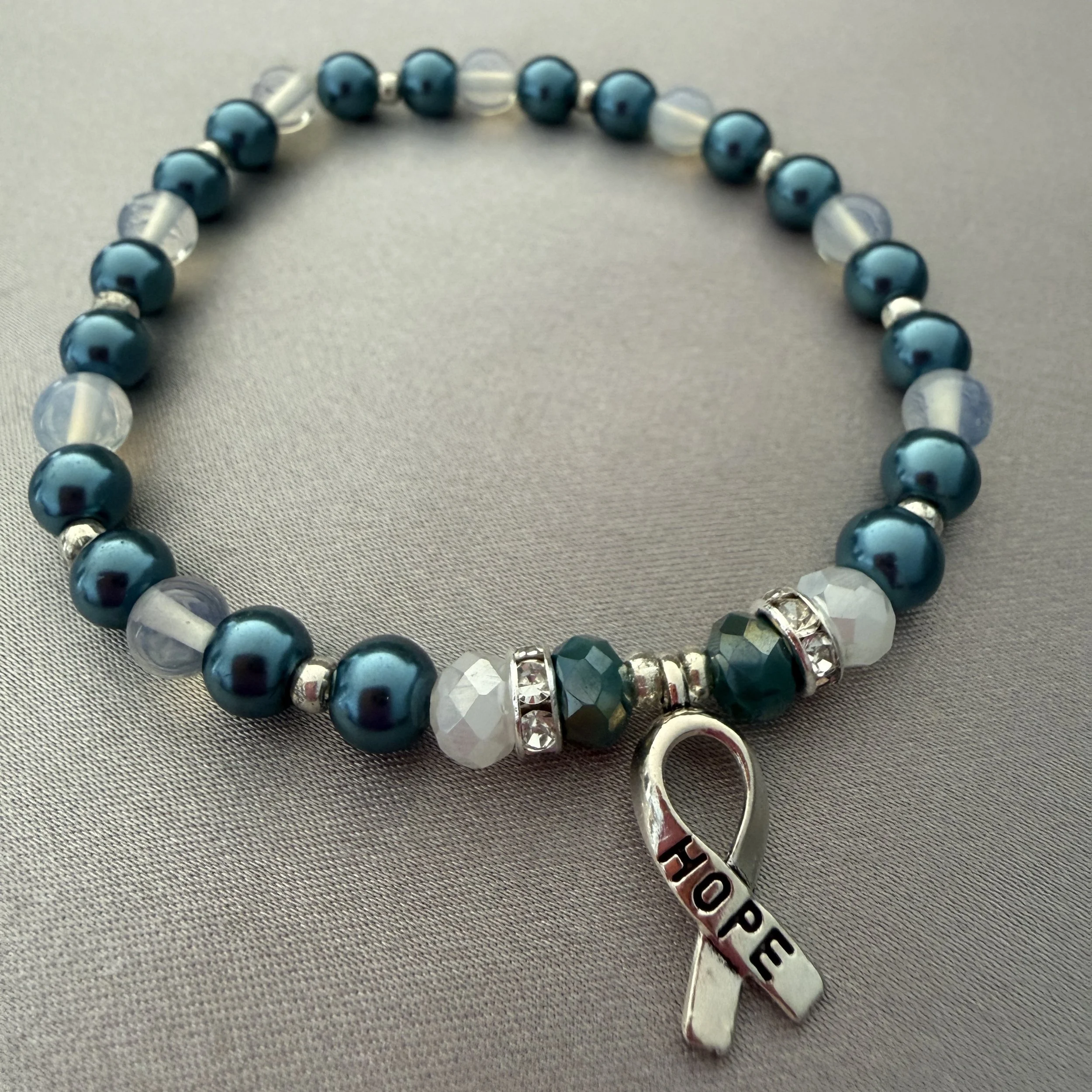 Teal and White Beaded Bracelet W/Hope Ribbon Charm
