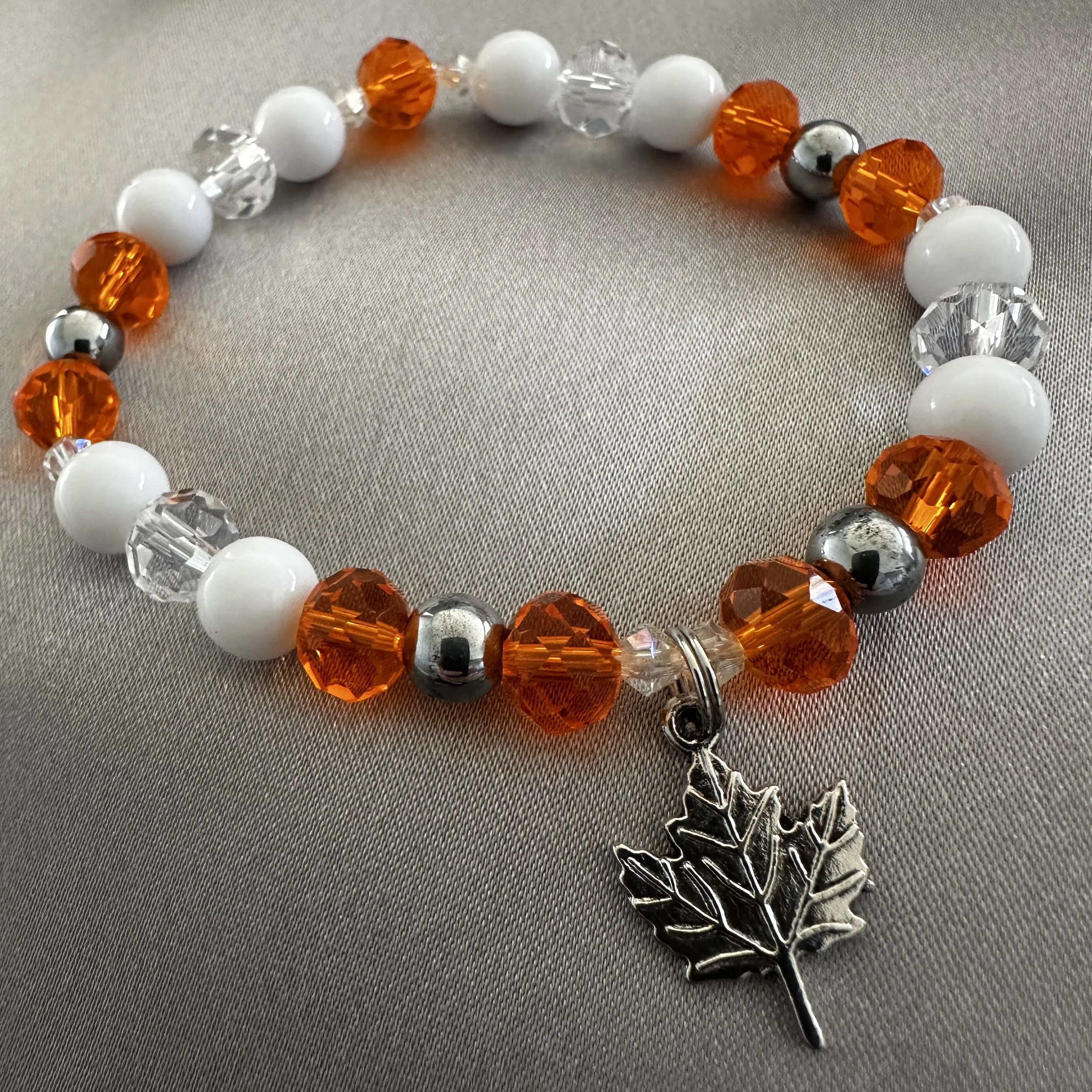 Orange, White and Clear Beaded Bracelet W/Leaf Charm