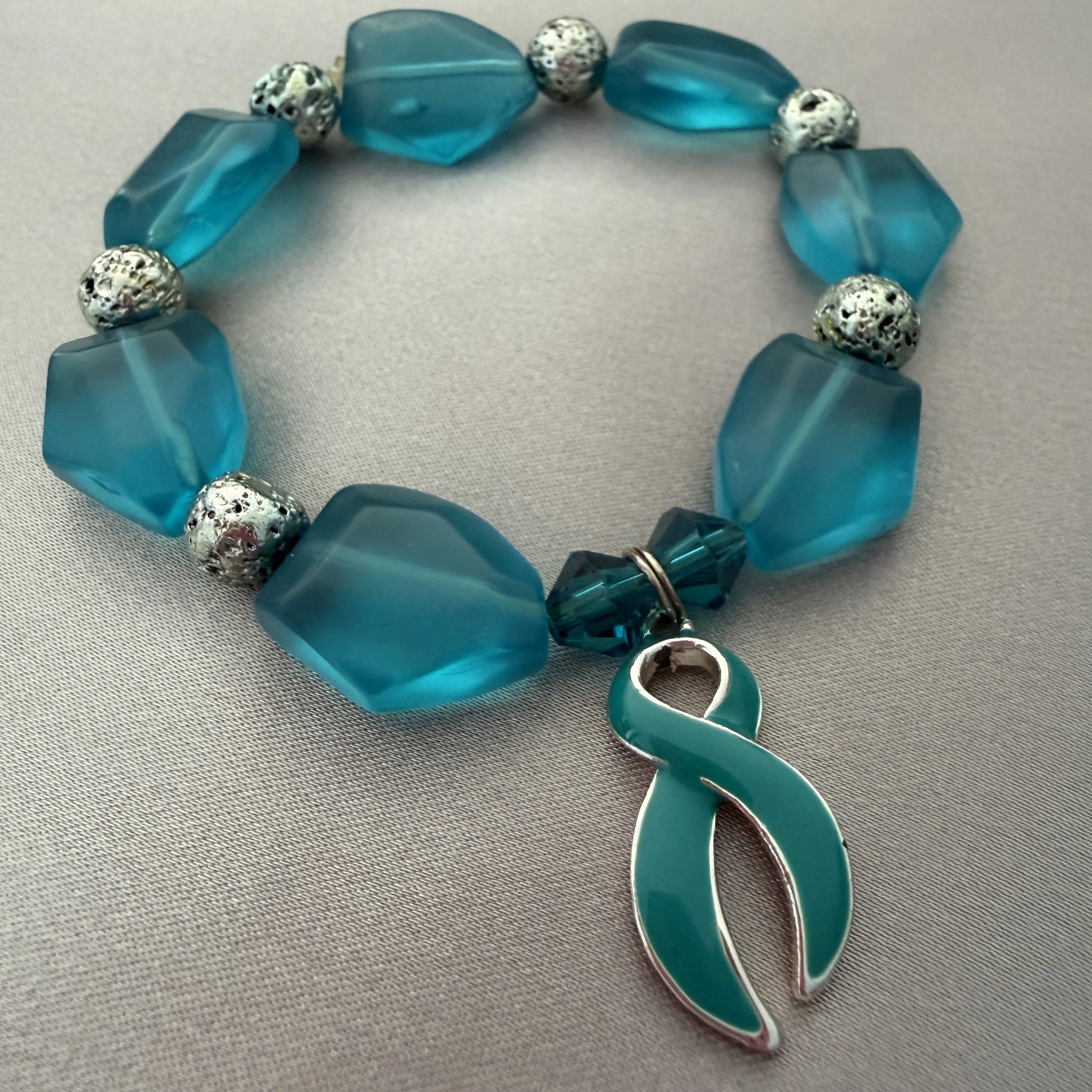 Teal Beaded Bracelet W/Teal Ribbon Charm