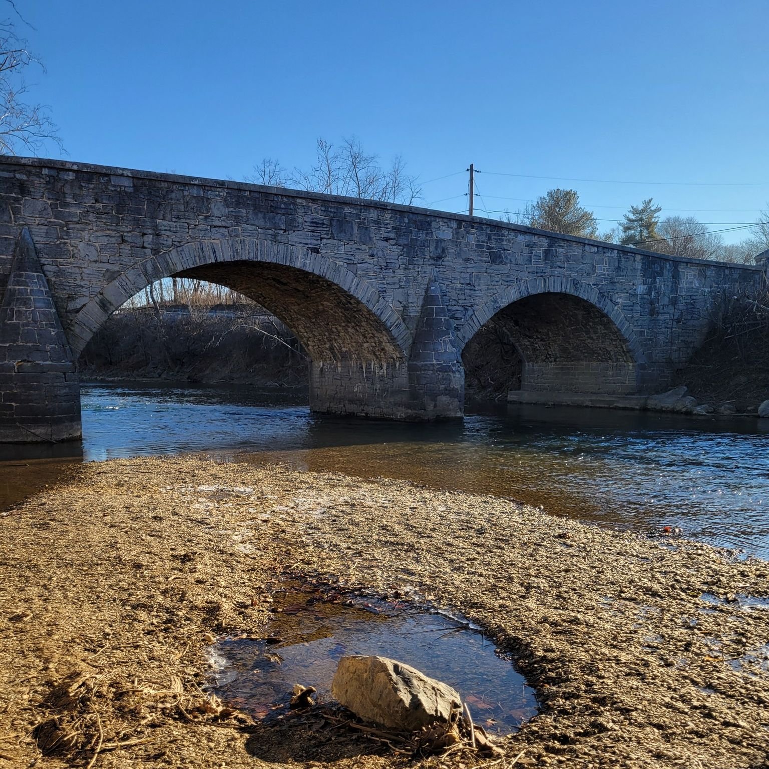 Van Meter Ford Stone Bridge was listed on the National Register of Historic Places on August 22, 1977. This three-span, stone-arch bridge was built in 1832 by Silas Harry under contract with the Berkeley County Court. It was constructed in order to e