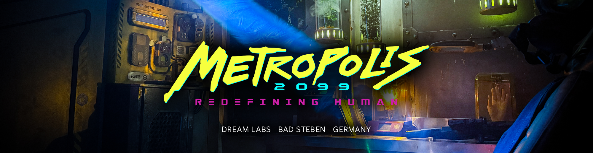 Futuristic laboratory setup with various scientific equipment, tubes with plants, and a person in a suit observing the scene. The prominent text reads 'Metropolis 2099 Redefining Human' with additional text indicating 'Dream Labs - Bad Stiben - Germany.'