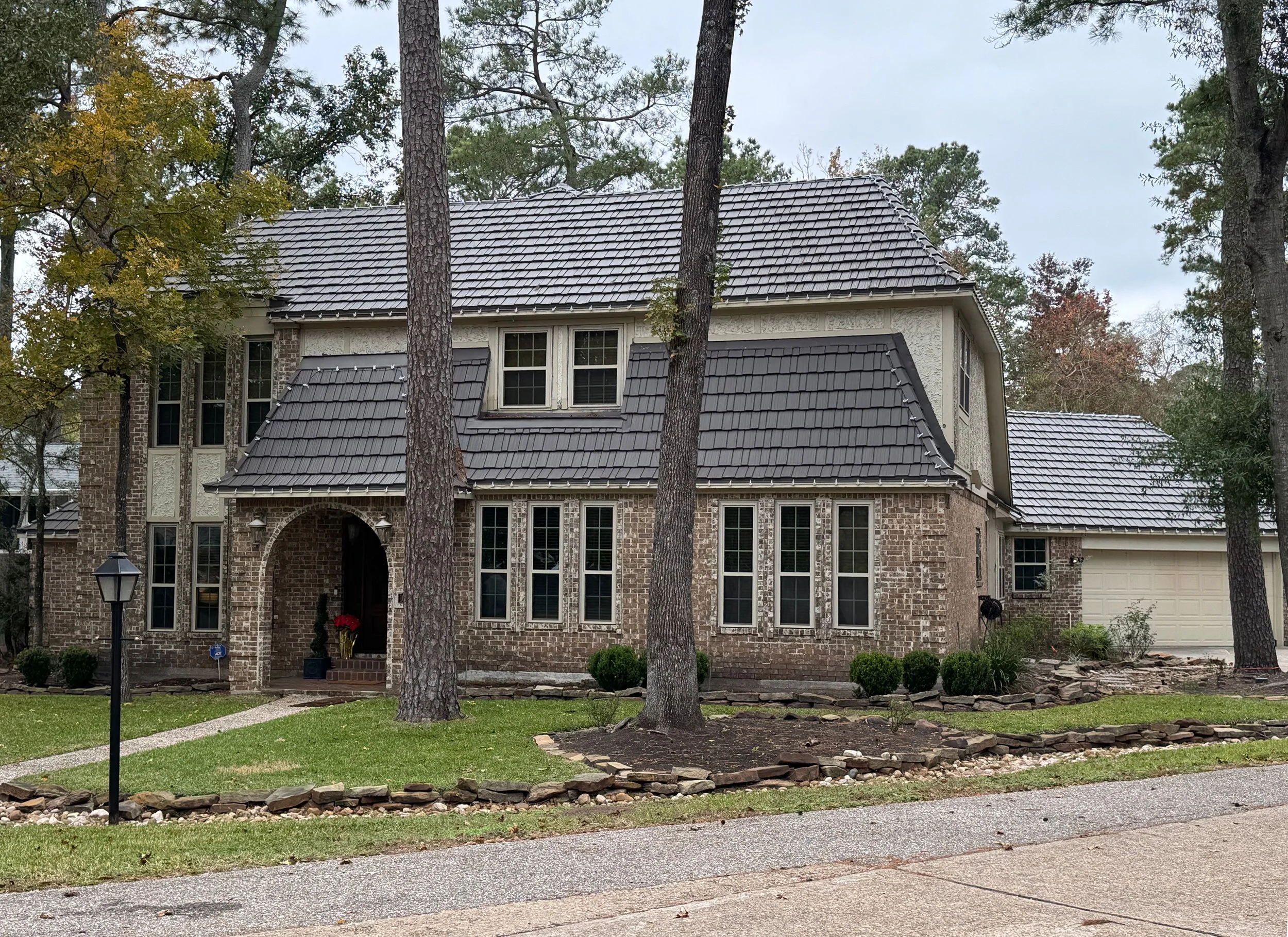 Original exterior before renovation – traditional brick home
