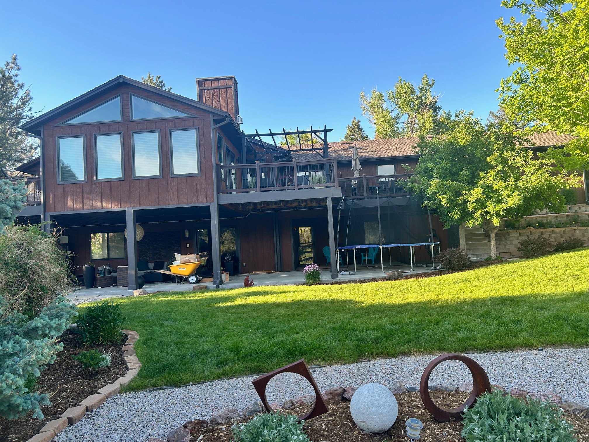 Before exterior of wood sided home in Parker Colorado