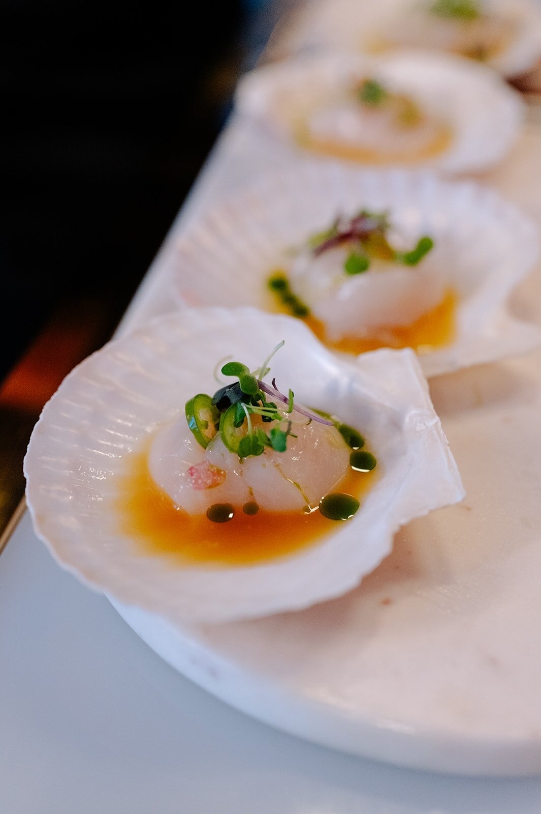 As seen at El Borde and new to our menu, the Hokkaido Scallop (imported from Japan!)​​​​​​​​
.. ​​​​​​​​
 yuzu vinaigrette/finger lime/​​​​​​​​
water chestnut/ pickled serrano/ herb