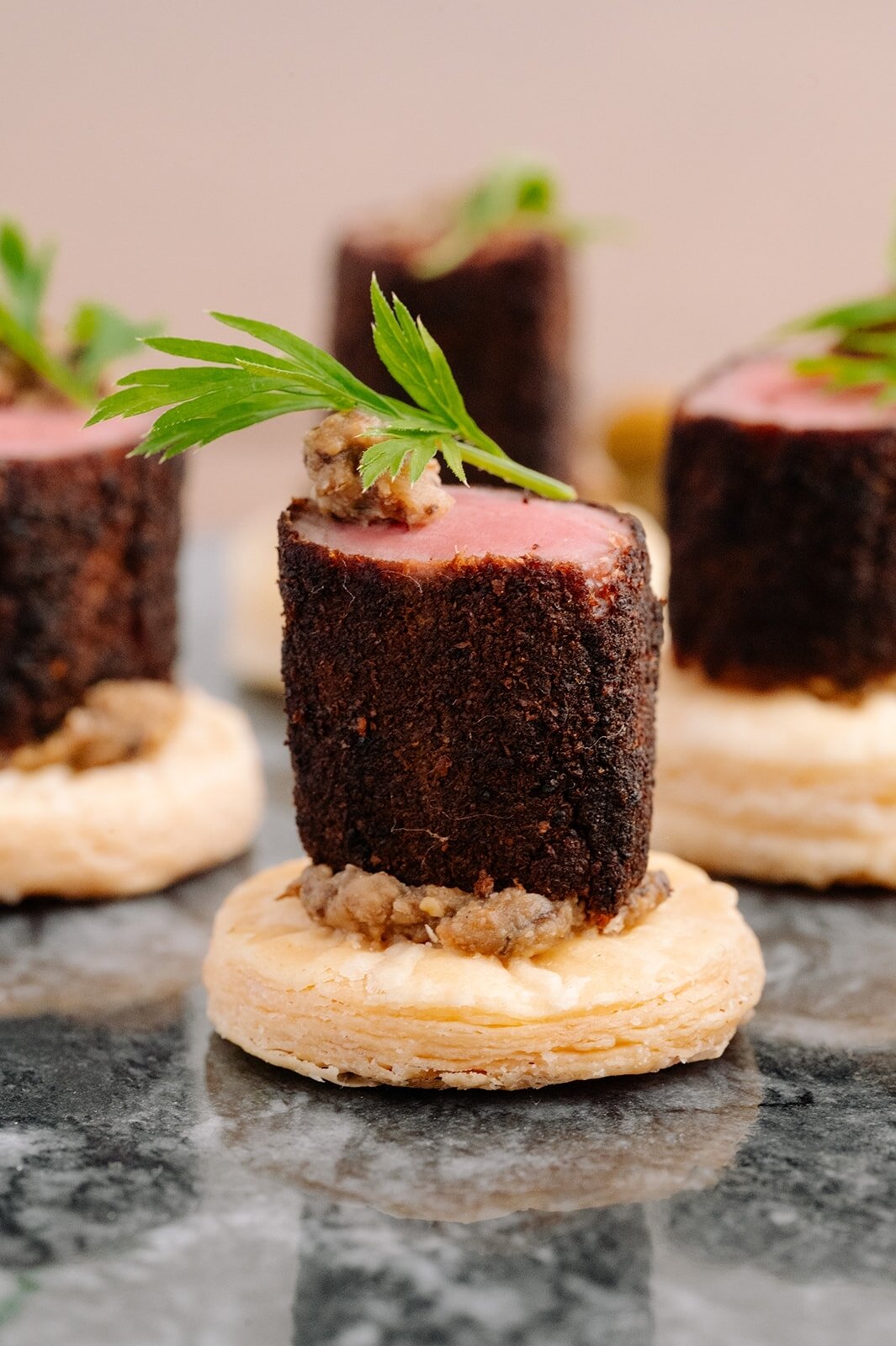 Since canapes are usually the first bite your guests will have at your wedding or event, be sure to wow their taste bud right off the top!
..
Pictured here is our incredible Beef Wellington - porcini crusted beef tenderloin, wild mushroom duxelle &am