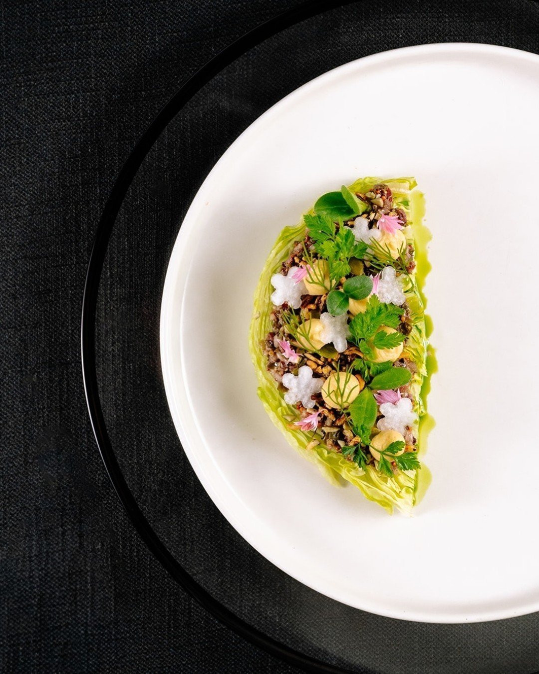 Is it a work of art&hellip; or a salad? 🎨🥗
We say both.

Meet The Berg &mdash; proof that salads can steal the spotlight:
🥬 Crisp iceberg
✨ Shallot vinaigrette
🌱 Chickpea pur&eacute;e
🍚 Puffed forbidden rice
🌸 Watermelon radish, fine herbs &amp