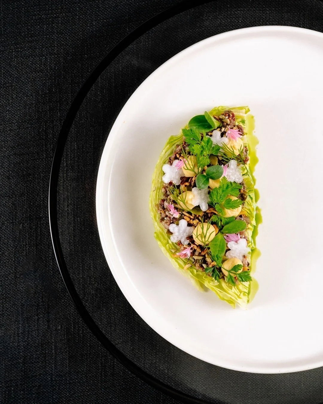 Is it a work of art&hellip; or a salad? 🎨🥗
We say both.

Meet The Berg &mdash; proof that salads can steal the spotlight:
🥬 Crisp iceberg
✨ Shallot vinaigrette
🌱 Chickpea pur&eacute;e
🍚 Puffed forbidden rice
🌸 Watermelon radish, fine herbs &amp