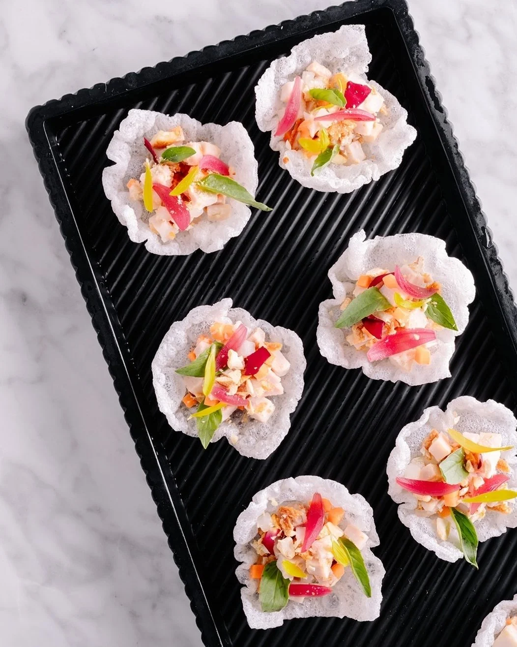 New canap&eacute; alert 🚨 

Say hello to our Chicken &amp; Rice ✨
A perfect little bite packed with BIG flavour: lemongrass chicken, crunchy water chestnuts, crispy shallots, pickled pearl onions, Thai basil, and toasted cashews&mdash;all sitting pr