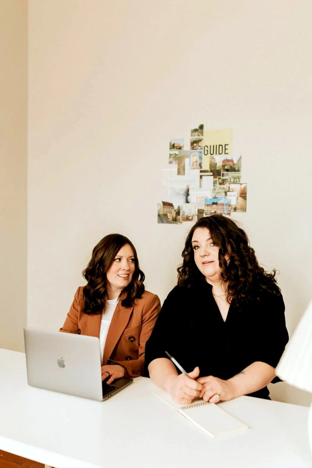 Supporting Realtors Across the Nation. Sitting at a white desk.